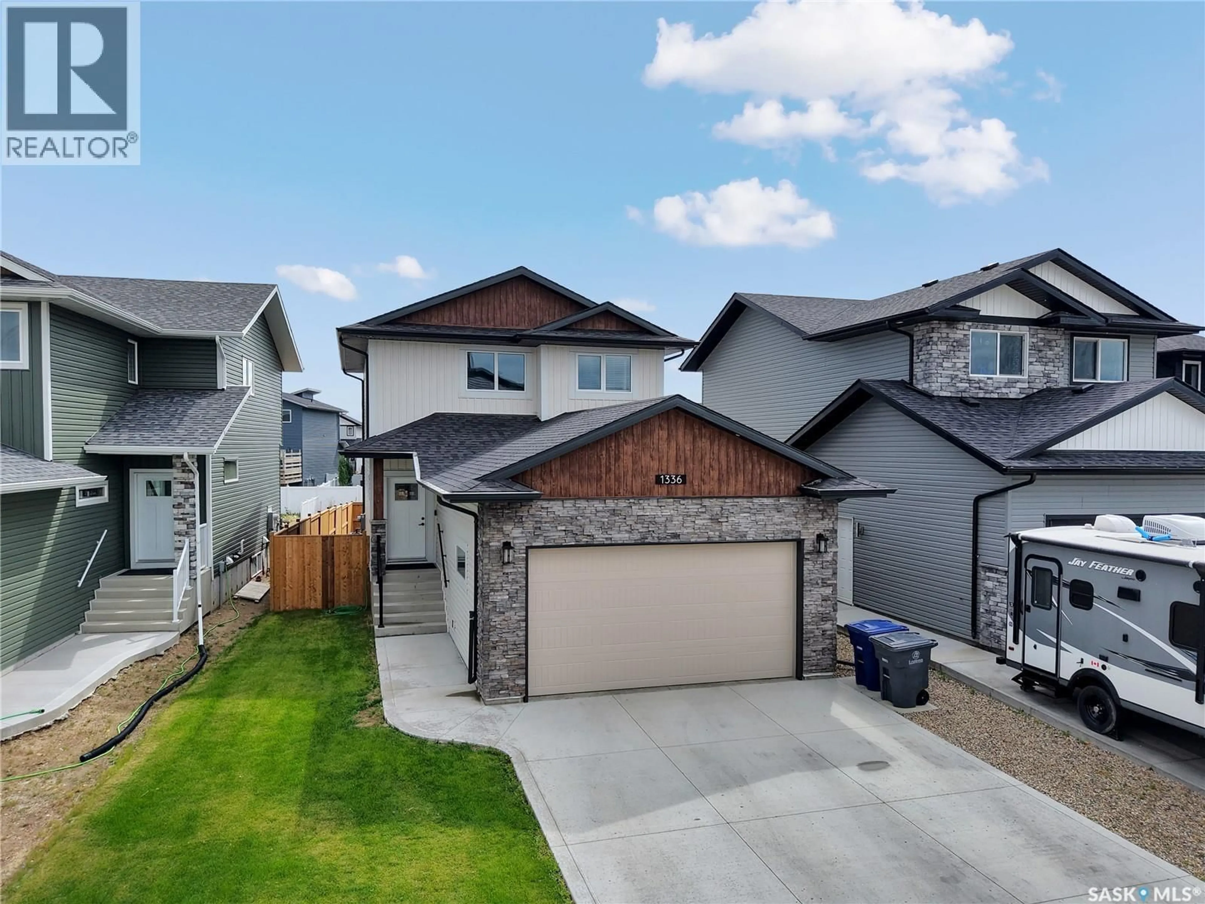 A pic from outside/outdoor area/front of a property/back of a property/a pic from drone, street for 1334 PARR HILL DRIVE, Martensville Saskatchewan S0K2T1