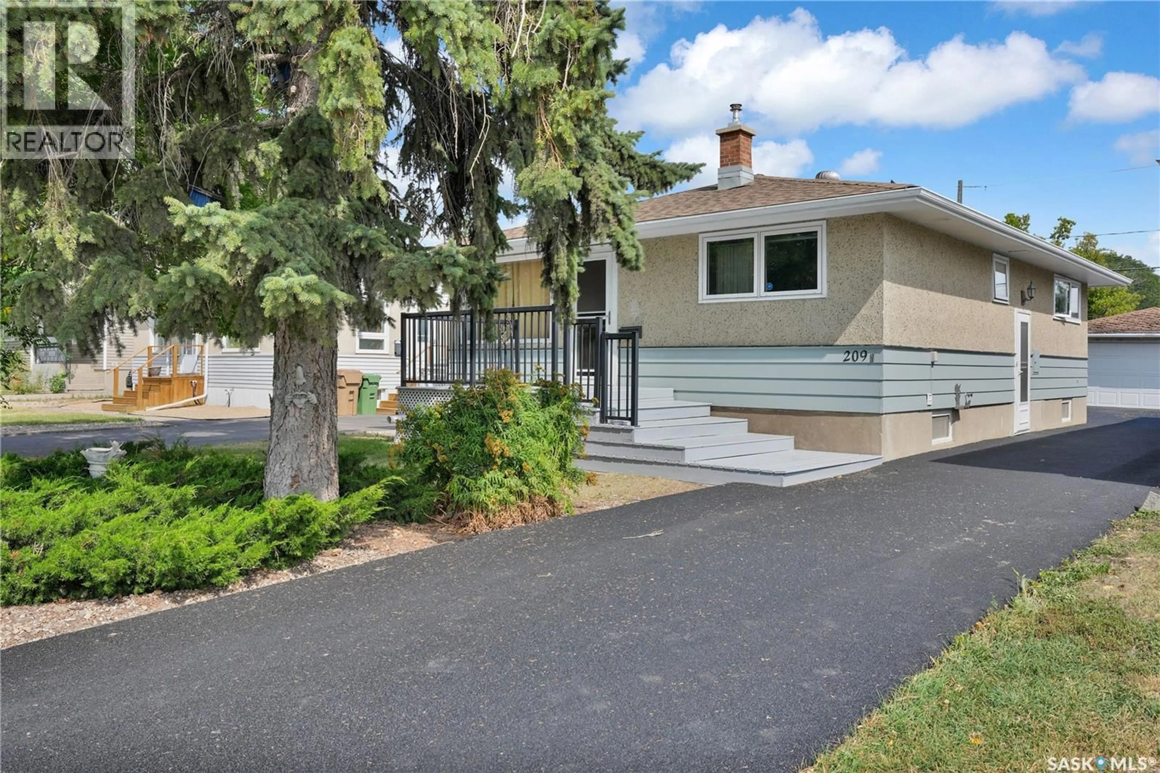 Home with vinyl exterior material, street for 209 BROAD STREET, Regina Saskatchewan S4R2X7