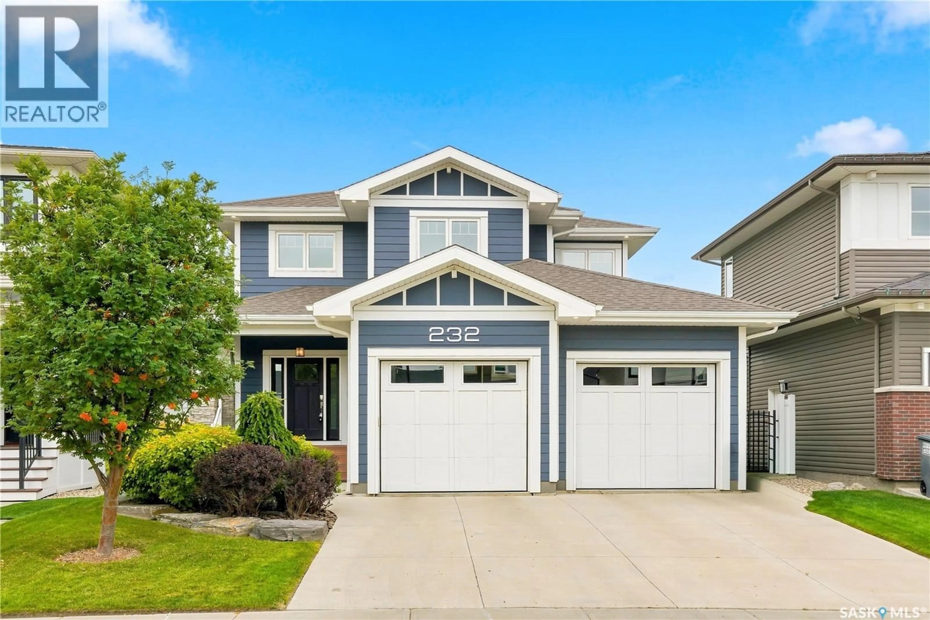 Home with vinyl exterior material, street for 232 SECORD WAY, Saskatoon Saskatchewan S7V0L9