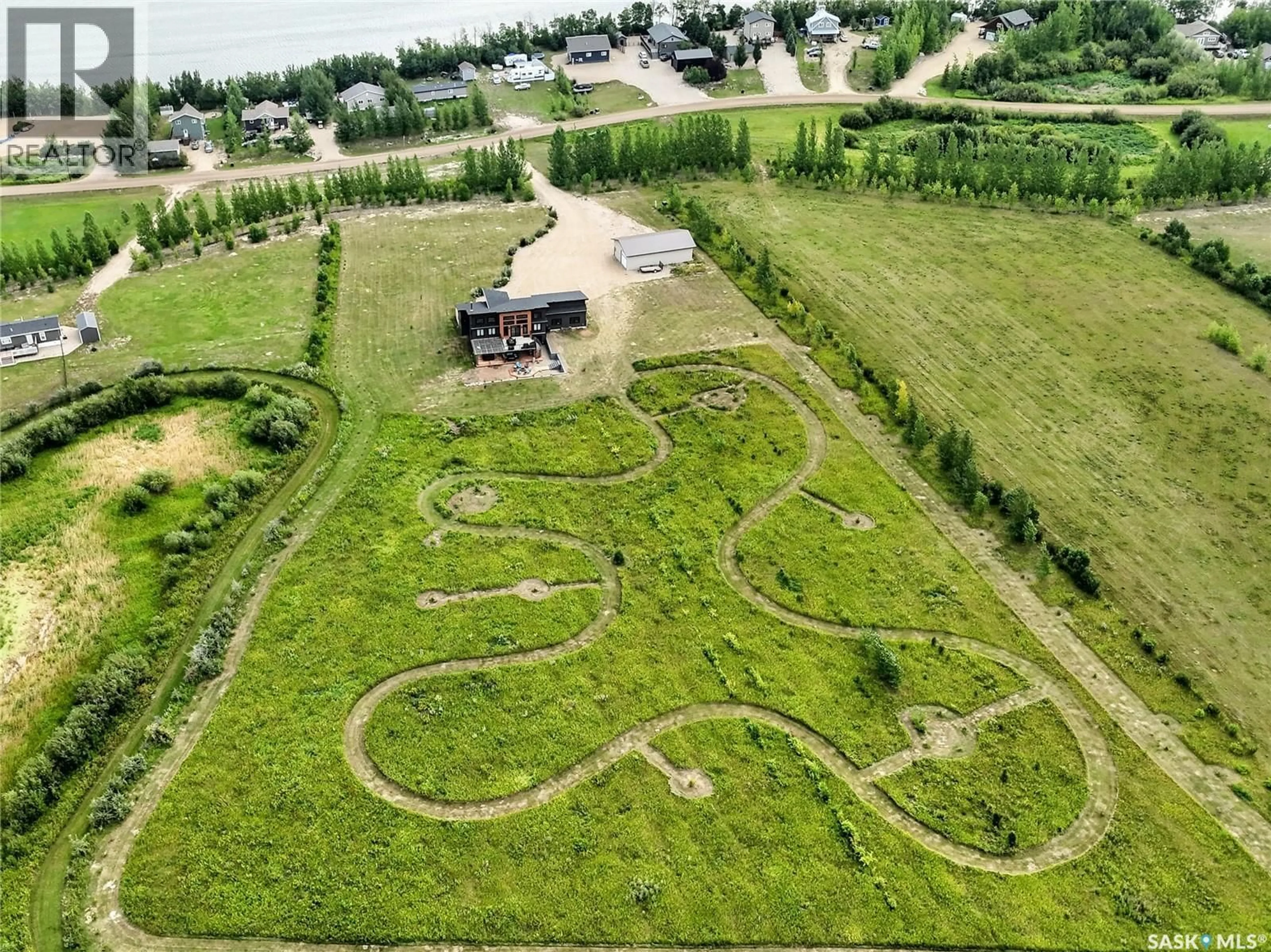A pic from outside/outdoor area/front of a property/back of a property/a pic from drone, street for 162 LUCIEN LAKESHORE DRIVE, Lucien Lake Saskatchewan S0K2X0