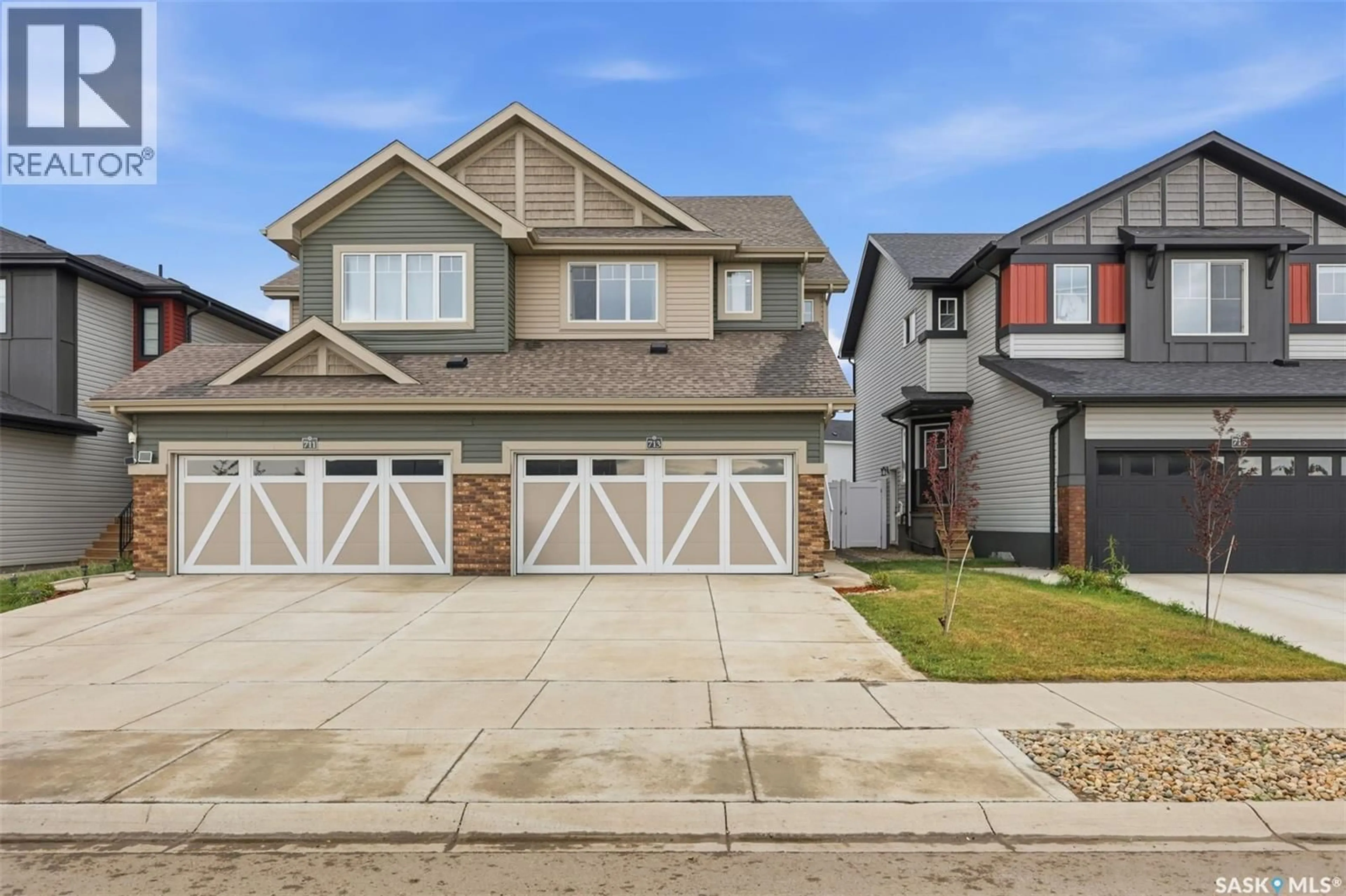 Home with vinyl exterior material, street for 713 BRIGHTON BOULEVARD, Saskatoon Saskatchewan S7V1P3