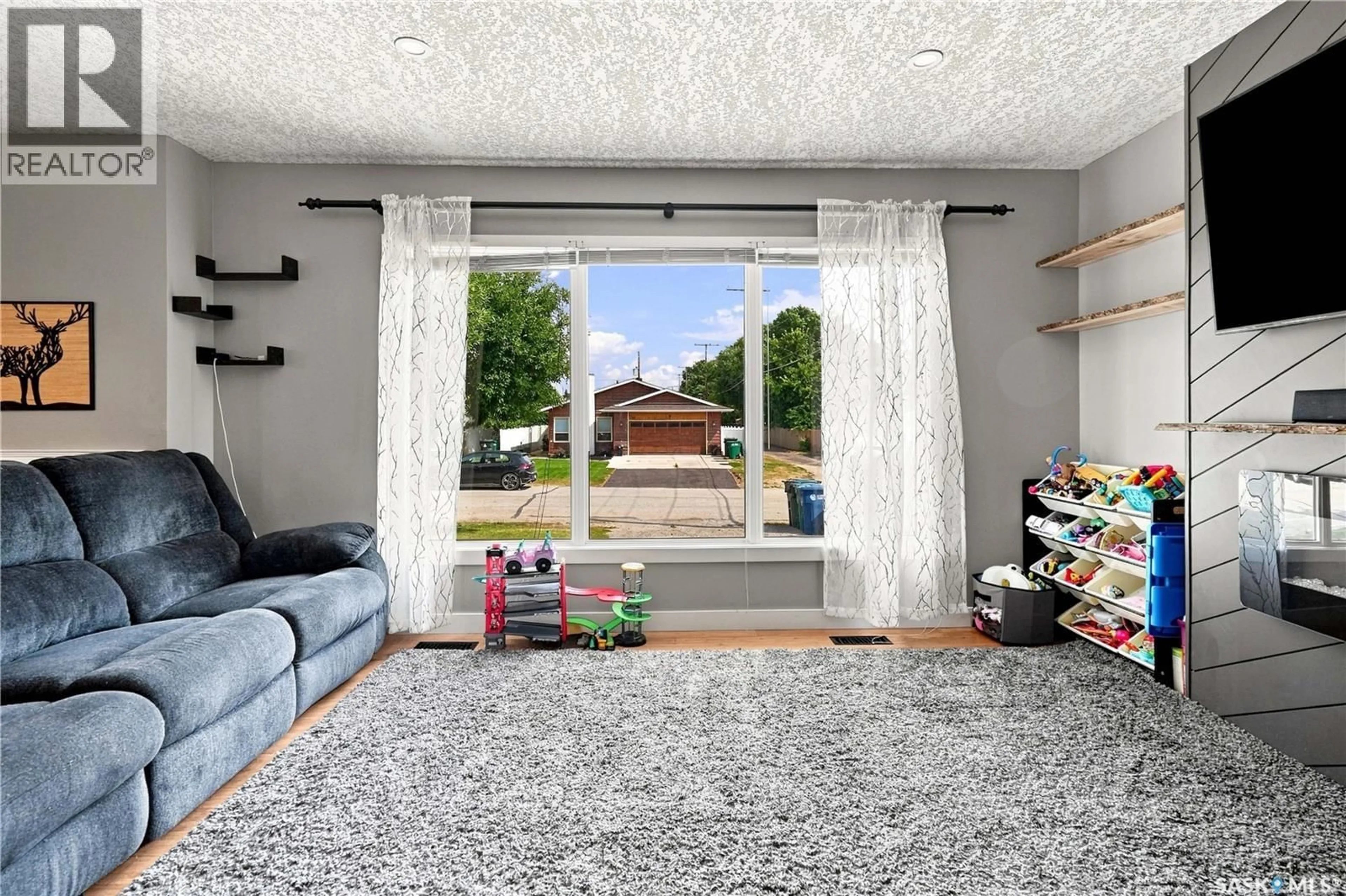 Living room with furniture, unknown for 130 6TH STREET, Pilot Butte Saskatchewan S0G3Z0