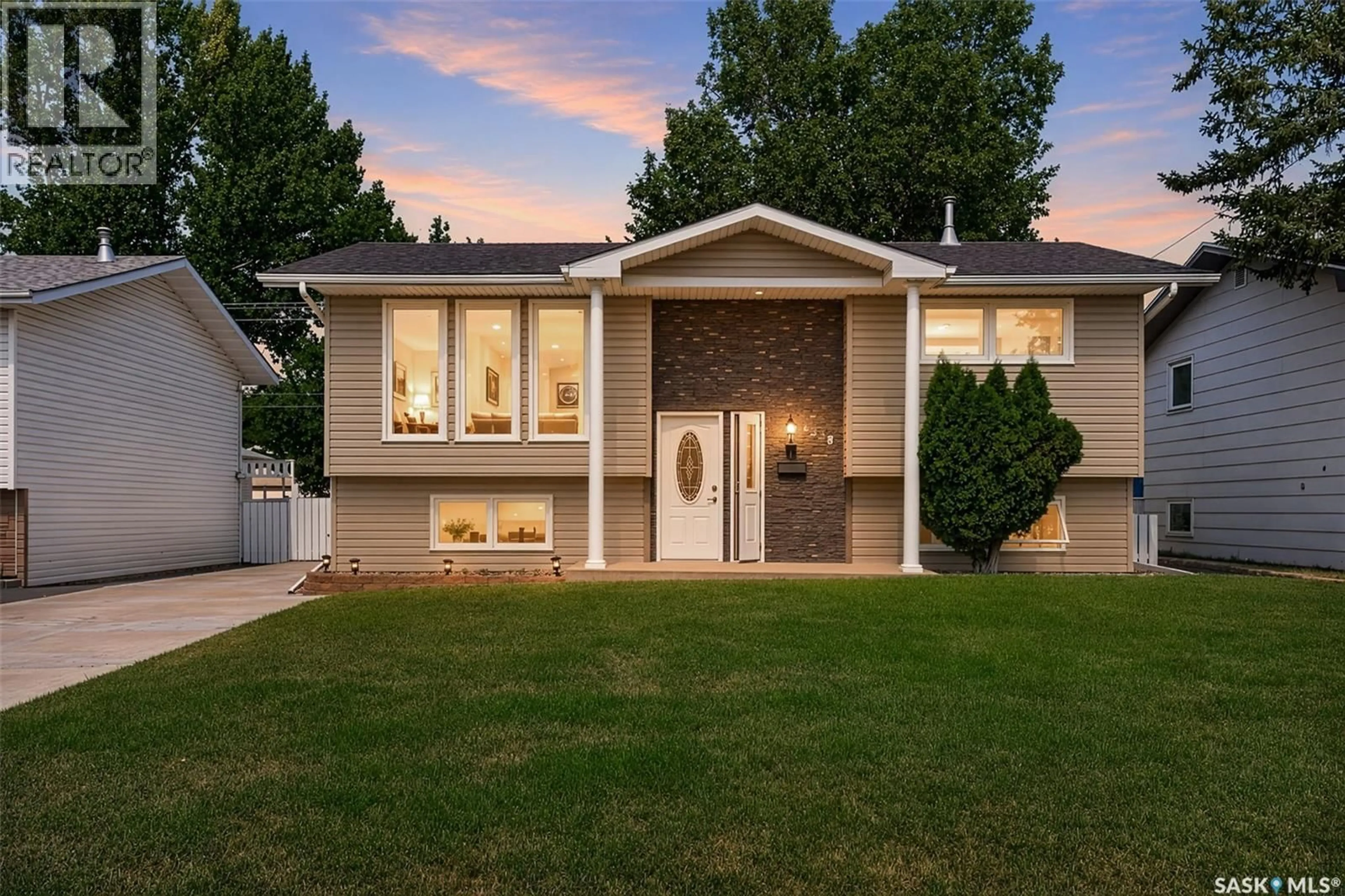 Home with vinyl exterior material, street for 1338 GLENDALE STREET, Moose Jaw Saskatchewan S6H6Y9
