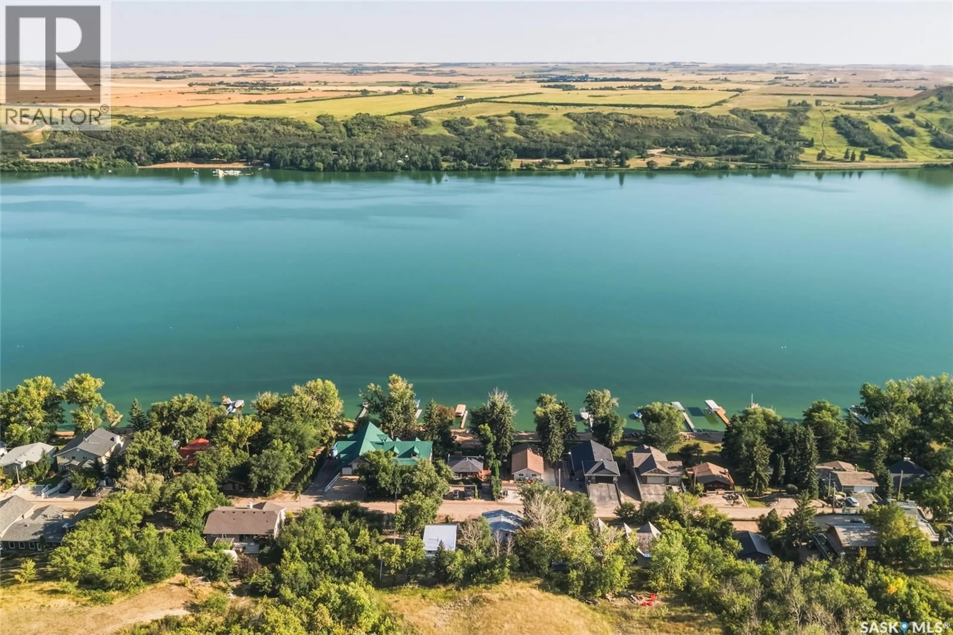 A pic from outside/outdoor area/front of a property/back of a property/a pic from drone, water/lake/river/ocean view for 99 SUMMERFELDT DRIVE, Thode Saskatchewan S0K1K0