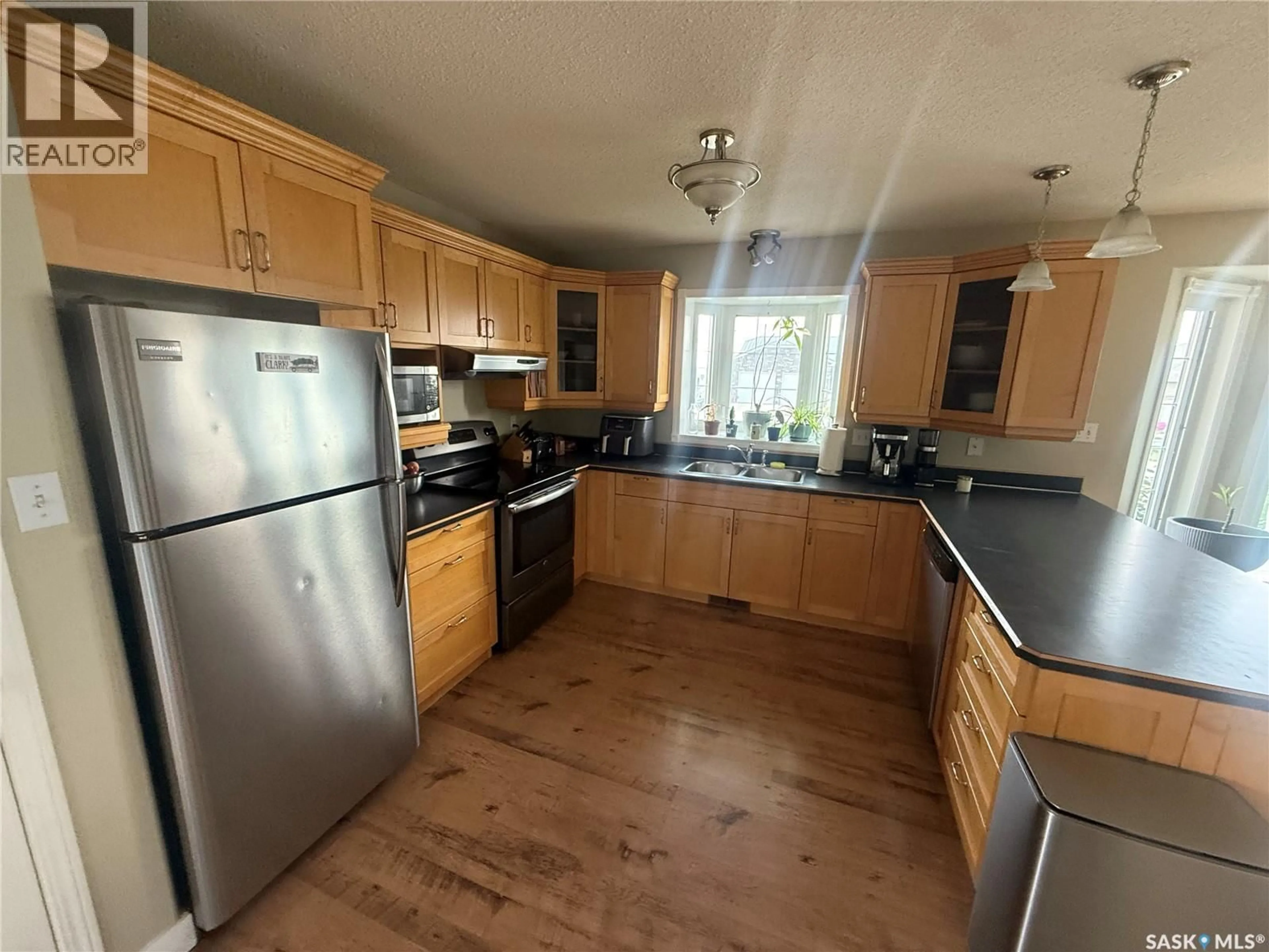 Standard kitchen, wood/laminate floor for 6 SHAW PLACE, Assiniboia Saskatchewan S0H0B0