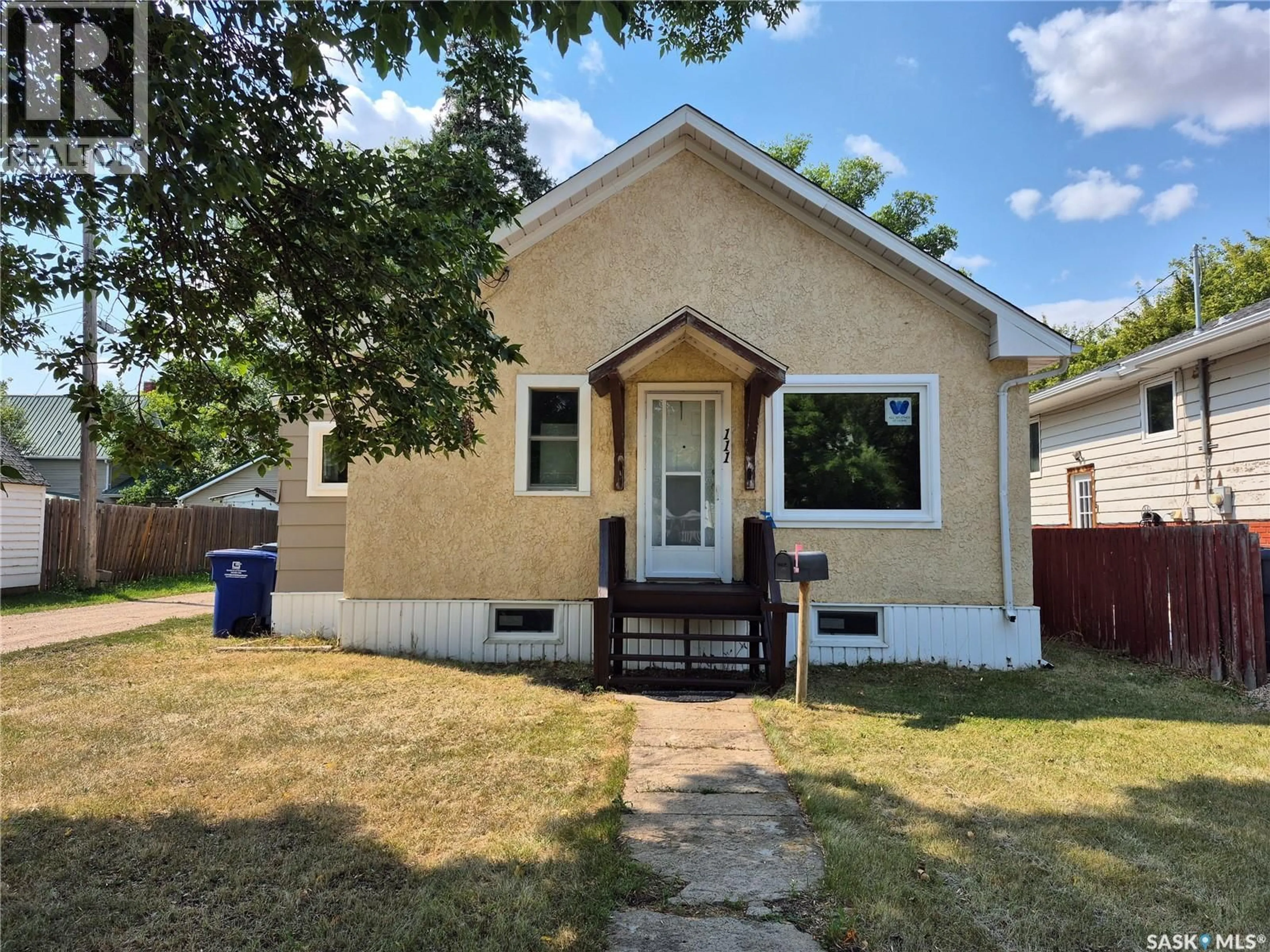Home with vinyl exterior material, street for 111 9TH STREET, Weyburn Saskatchewan S4H1E8
