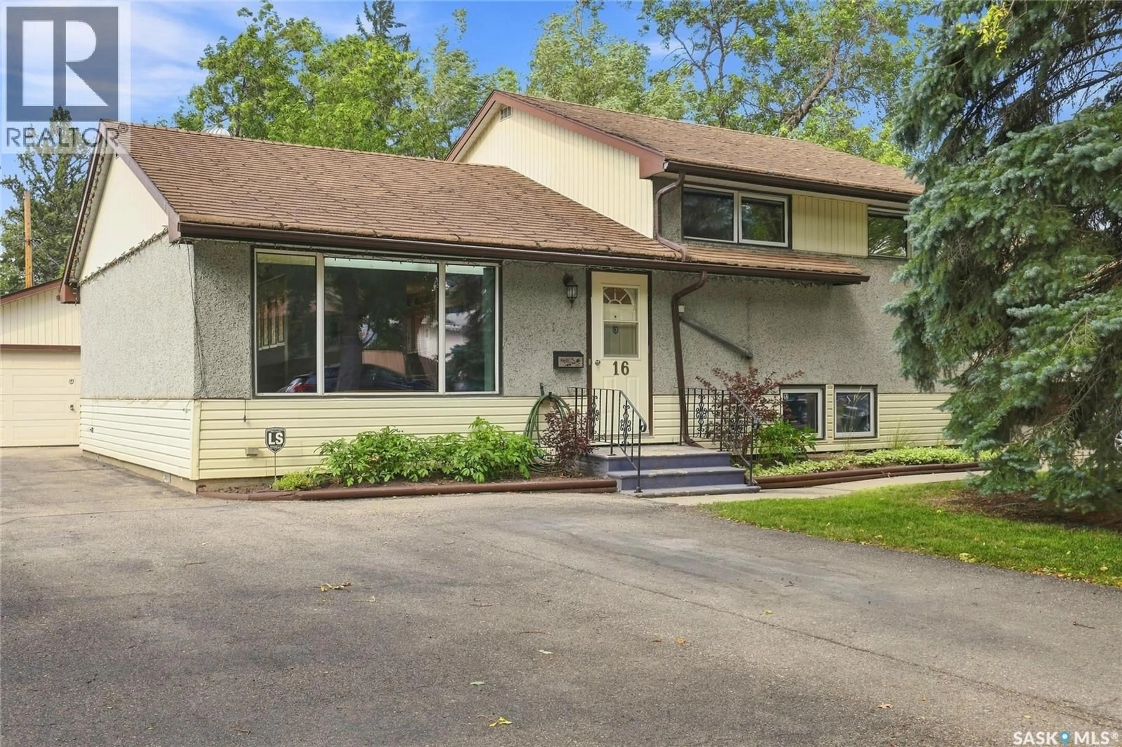 Home with vinyl exterior material, street for 16 YARNTON CRESCENT, Regina Saskatchewan S4R4A2