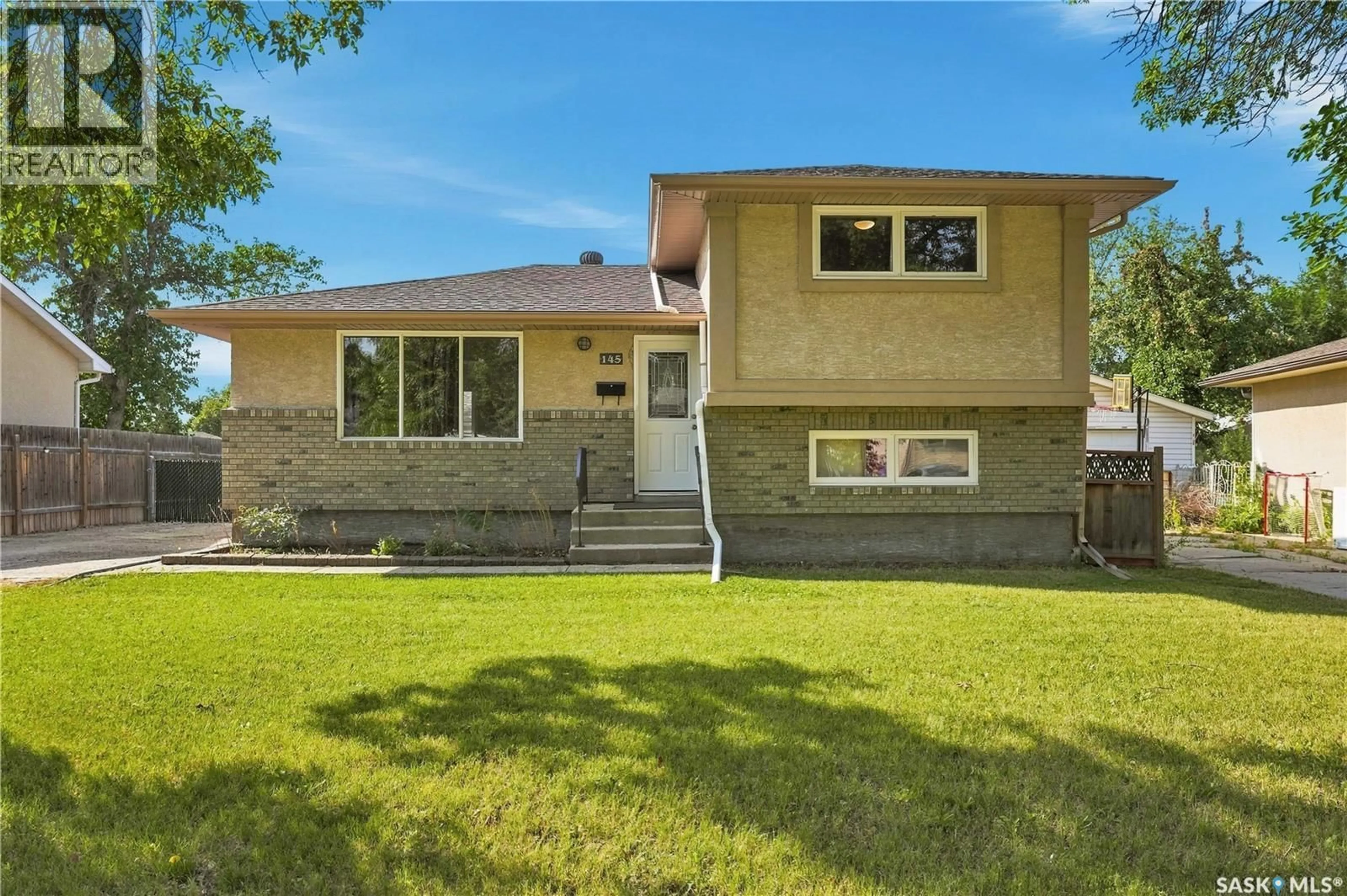 Home with brick exterior material, street for 145 DALGLIESH DRIVE, Regina Saskatchewan S4R5T1