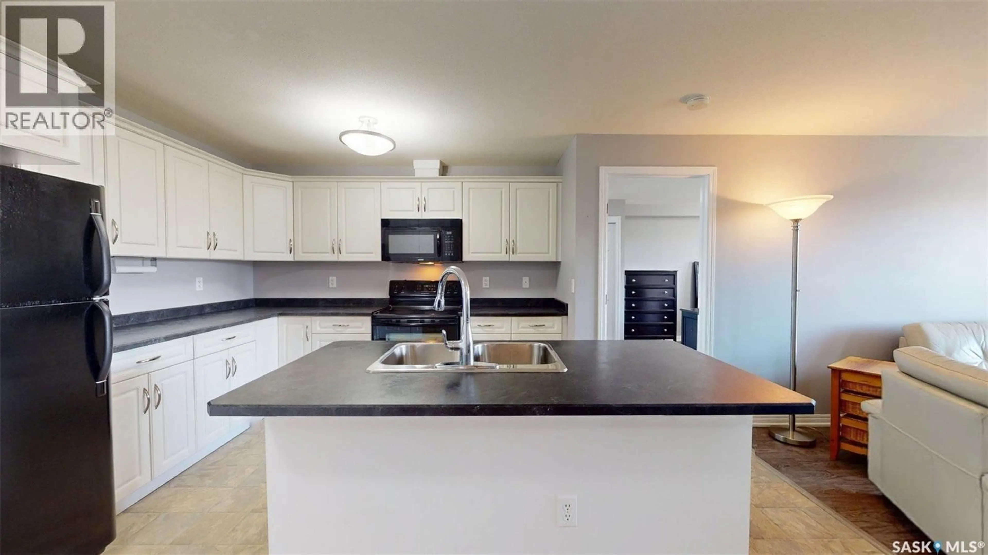 Open concept kitchen, ceramic/tile floor for 600 - 210 CENTENNIAL BOULEVARD, Warman Saskatchewan S0K4S1