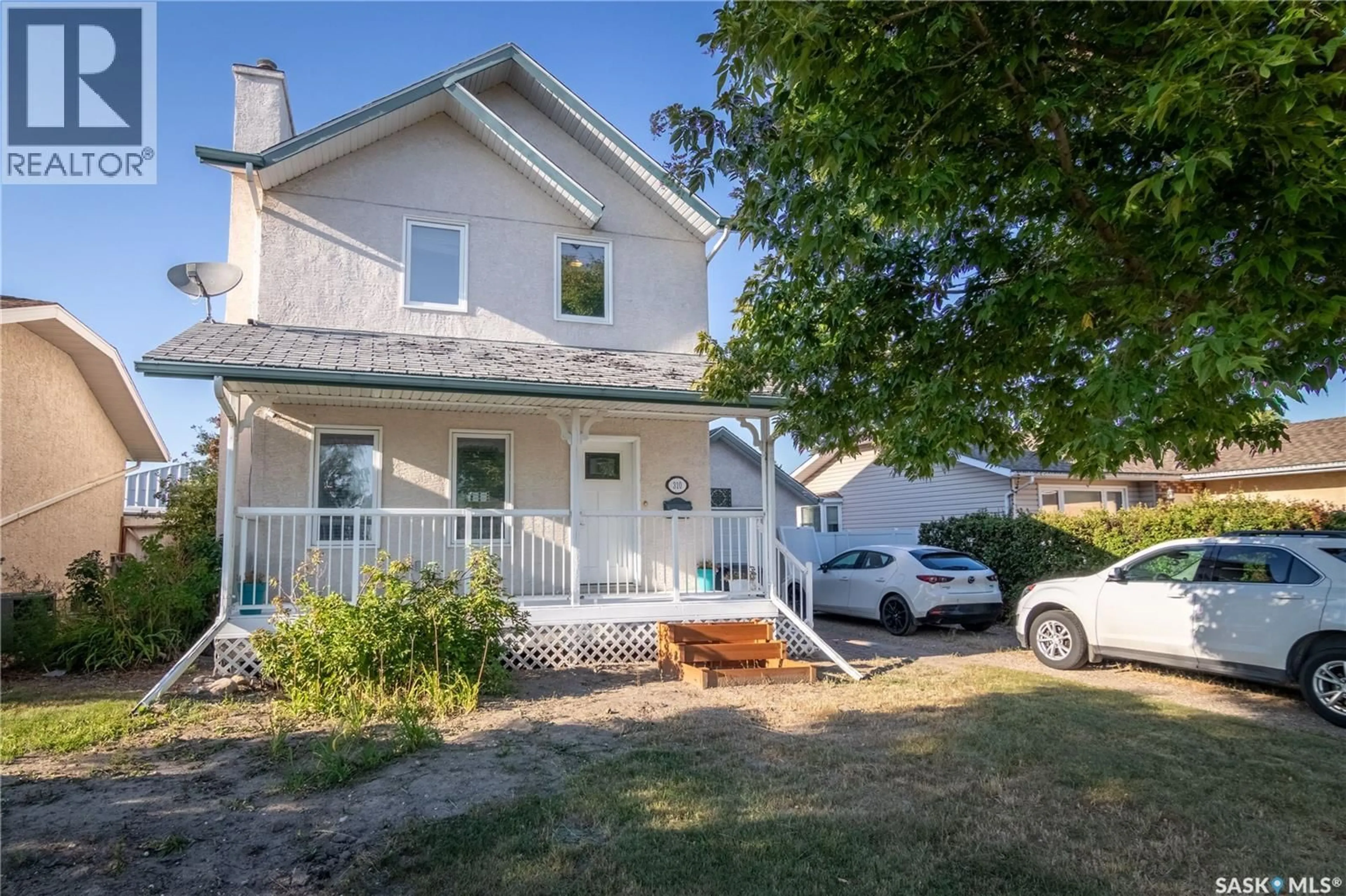 Home with vinyl exterior material, street for 310 ASSINIBOIA STREET, Balgonie Saskatchewan S0G0E0