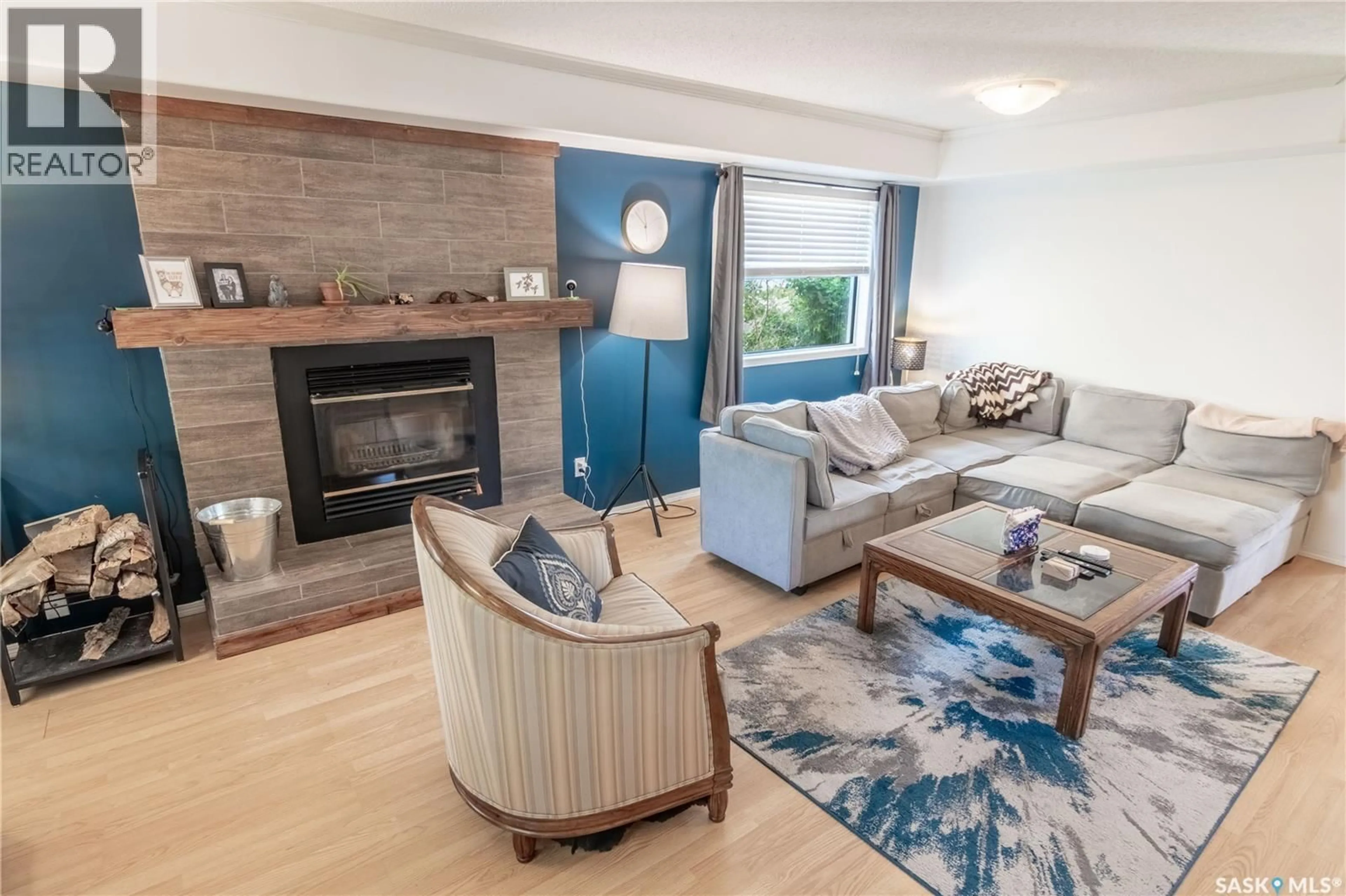 Living room with furniture, wood/laminate floor for 310 ASSINIBOIA STREET, Balgonie Saskatchewan S0G0E0
