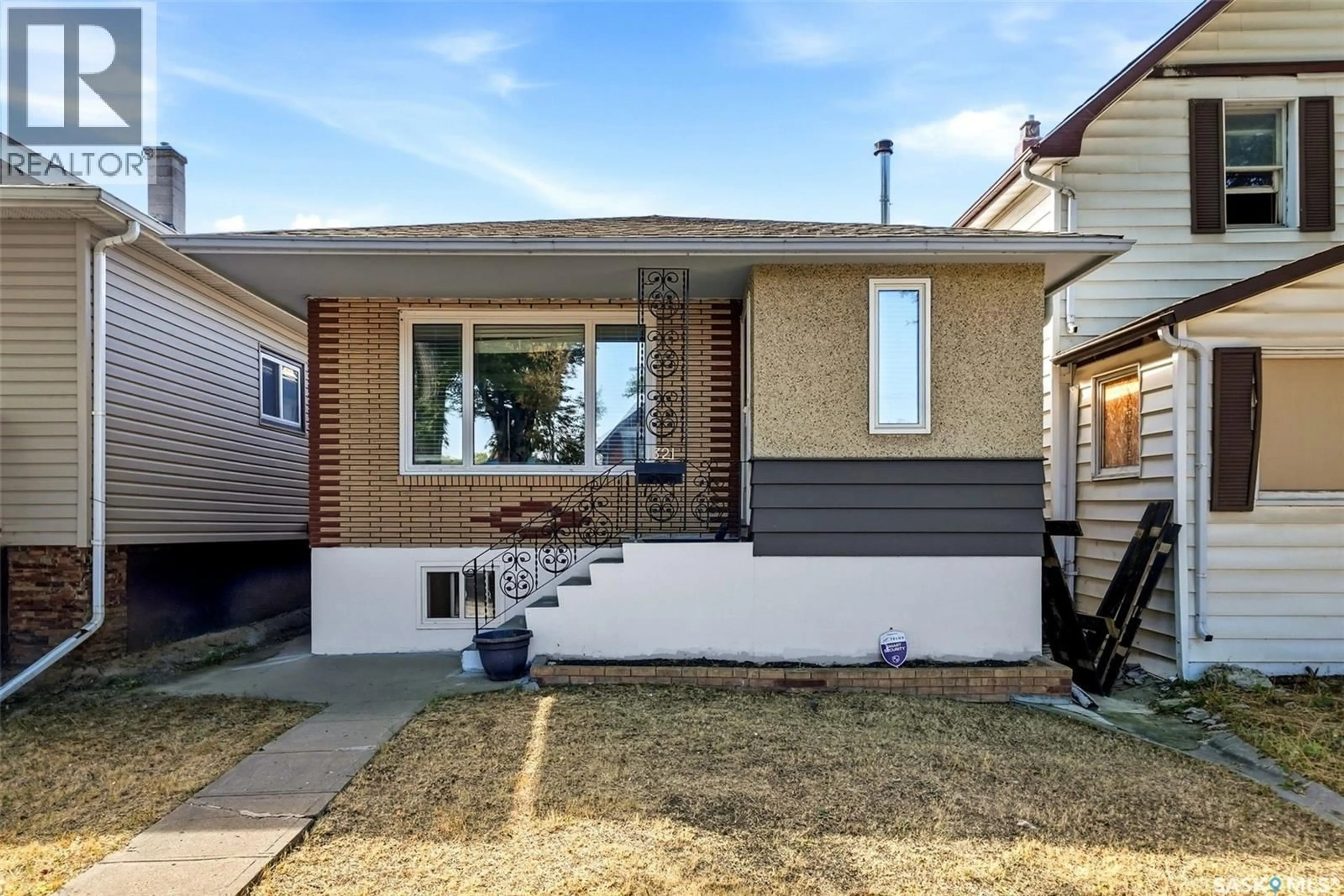 Home with brick exterior material, street for 1321 VICTORIA AVENUE, Regina Saskatchewan S4P0P2