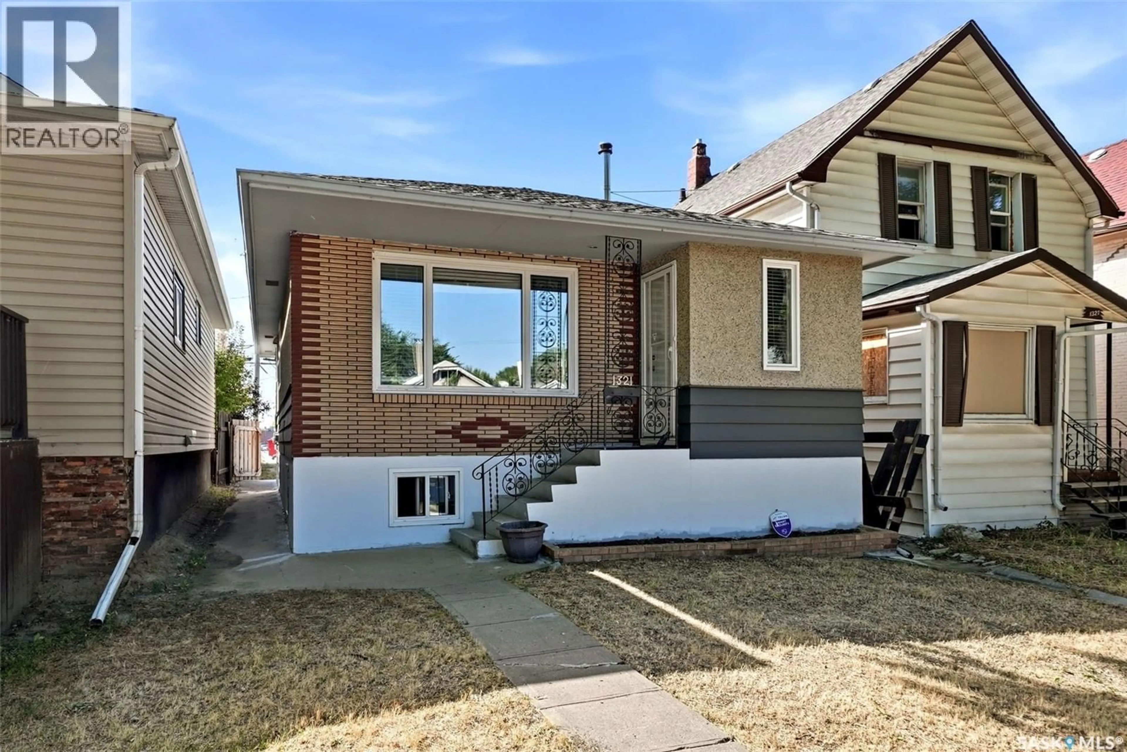 Home with brick exterior material, street for 1321 VICTORIA AVENUE, Regina Saskatchewan S4P0P2