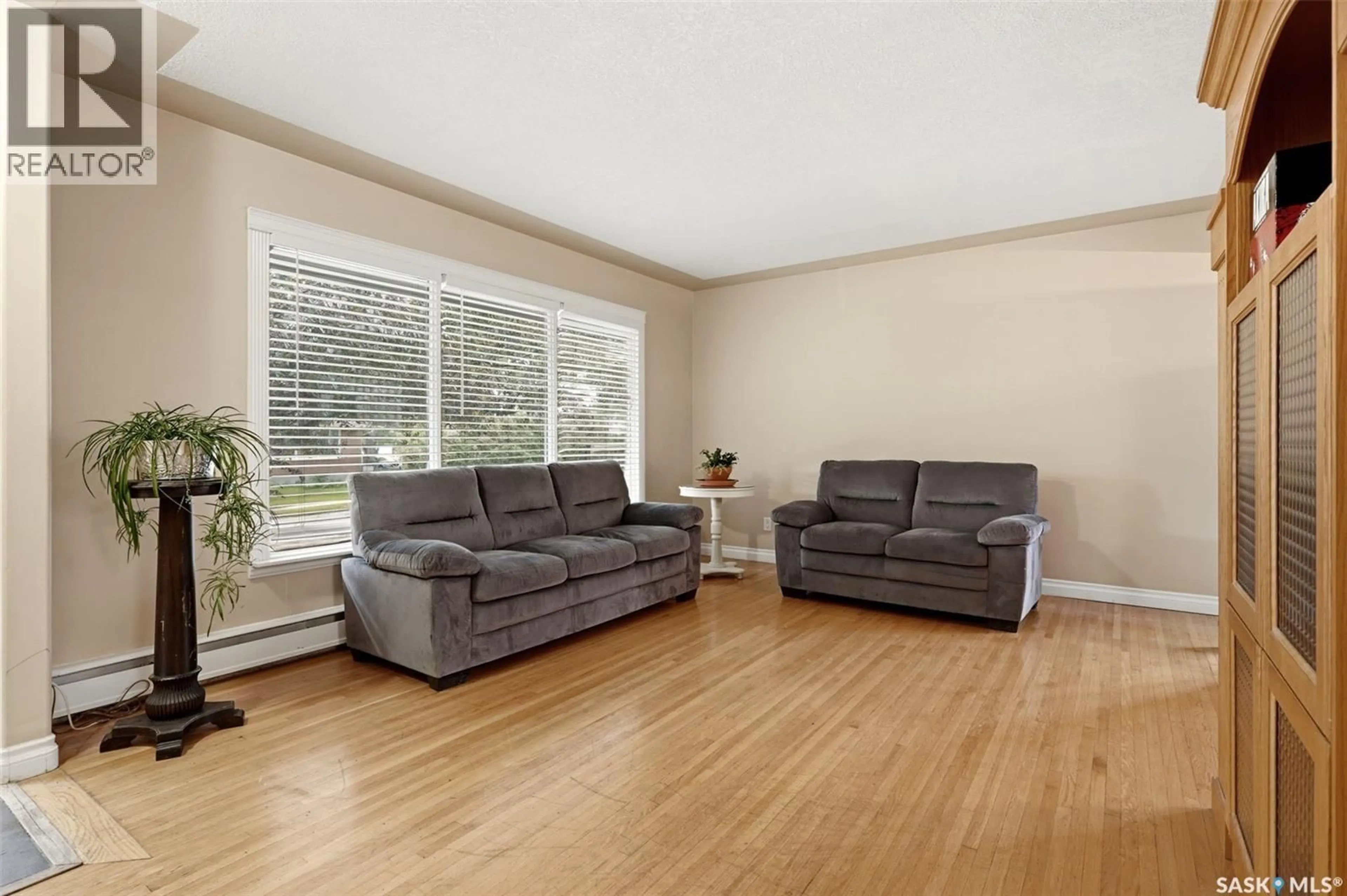 Living room with furniture, wood/laminate floor for 5 DARKE CRESCENT, Regina Saskatchewan S4S2W5