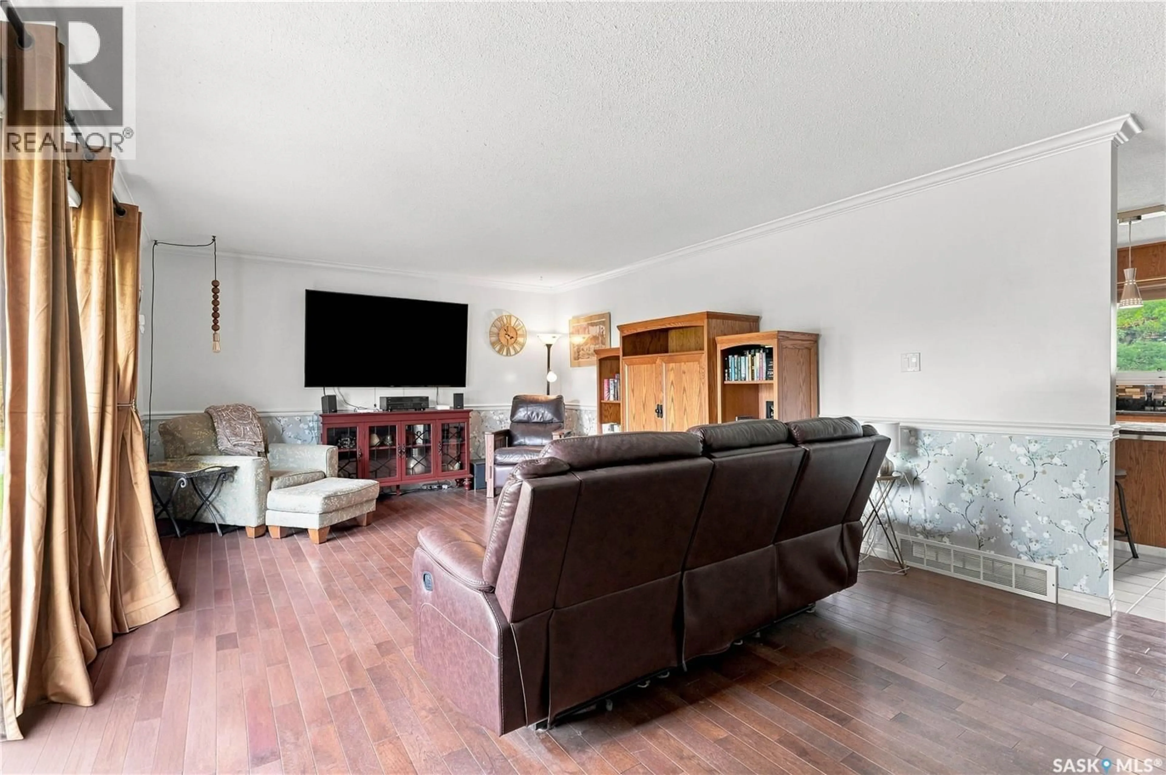 Living room with furniture, wood/laminate floor for 320 N ALLOWANCE ROAD, Blaine Lake Saskatchewan S0J0J0