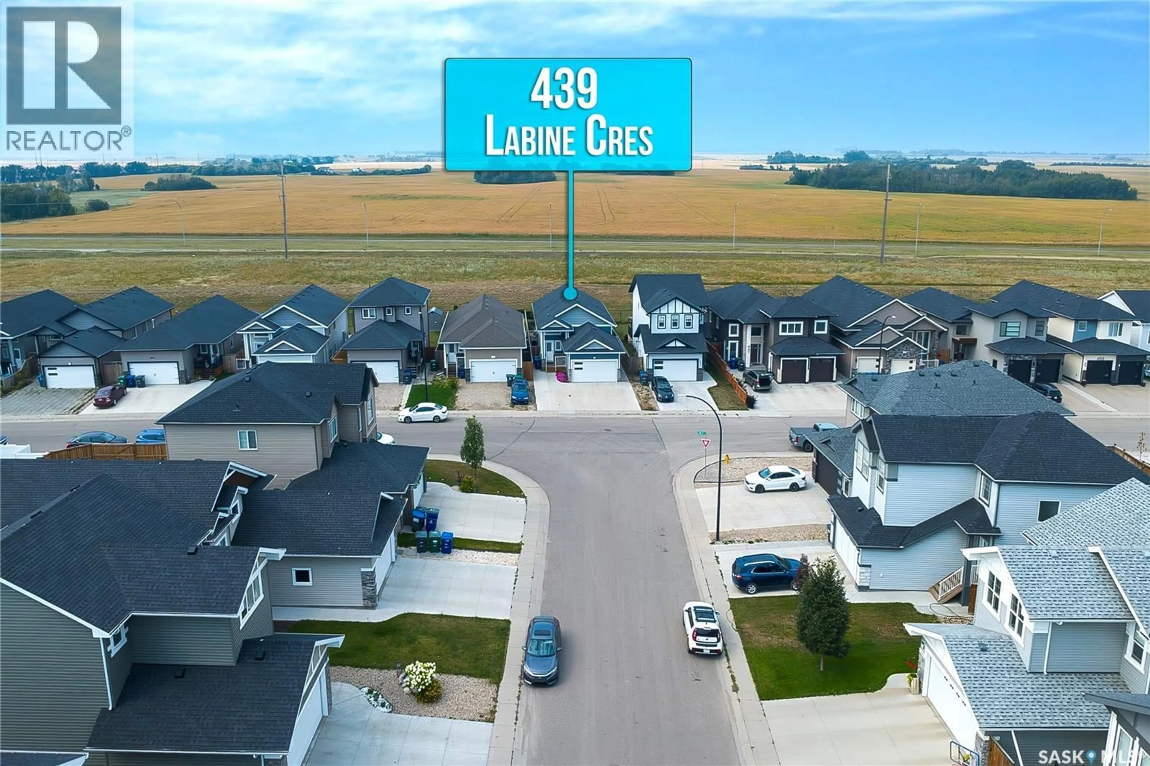 A pic from outside/outdoor area/front of a property/back of a property/a pic from drone, street for 439 LABINE CRESCENT, Saskatoon Saskatchewan S7L5Y5