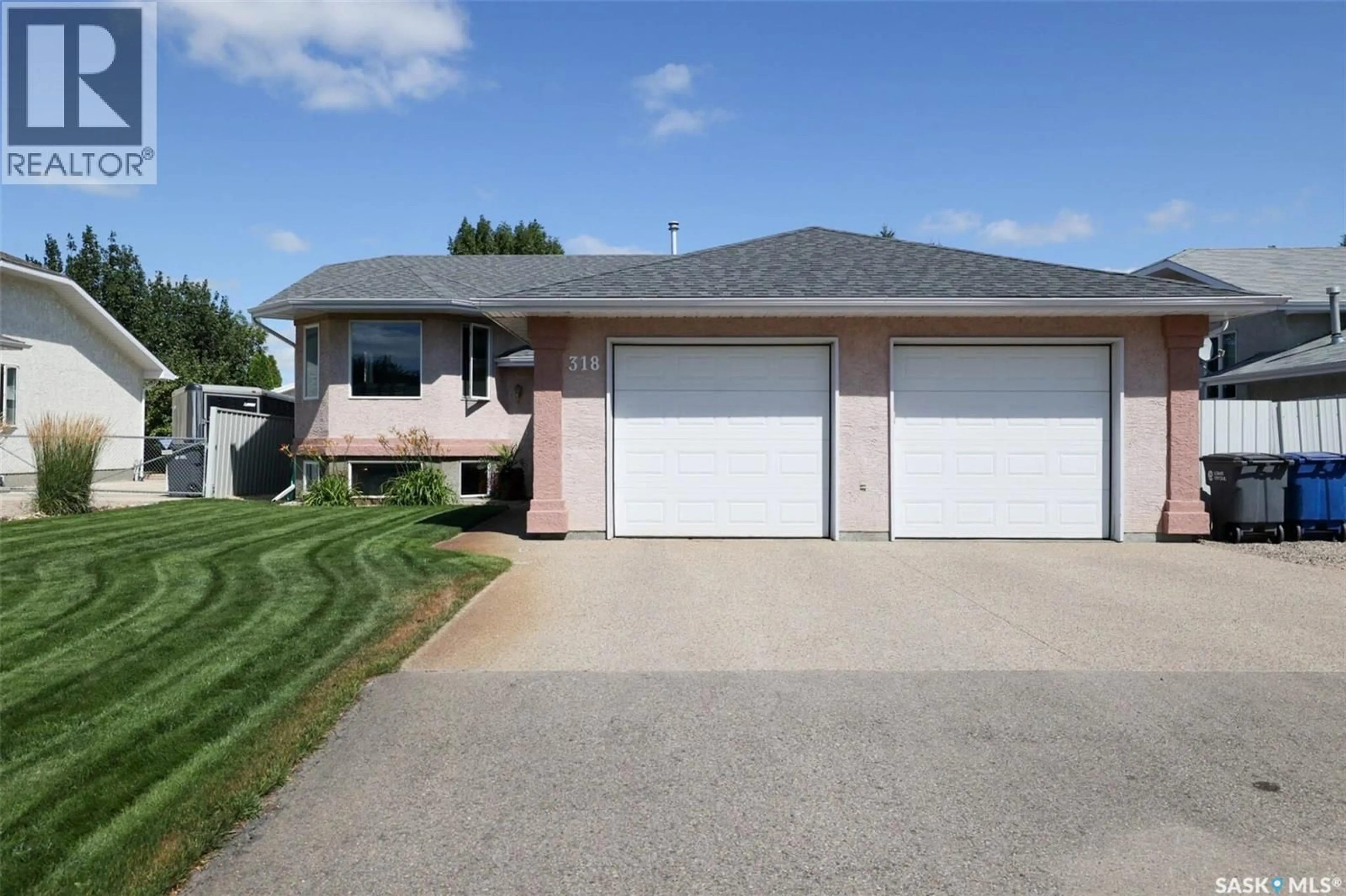 Home with vinyl exterior material, street for 318 HILLSIDE CRESCENT, Pilot Butte Saskatchewan S0G3Z0