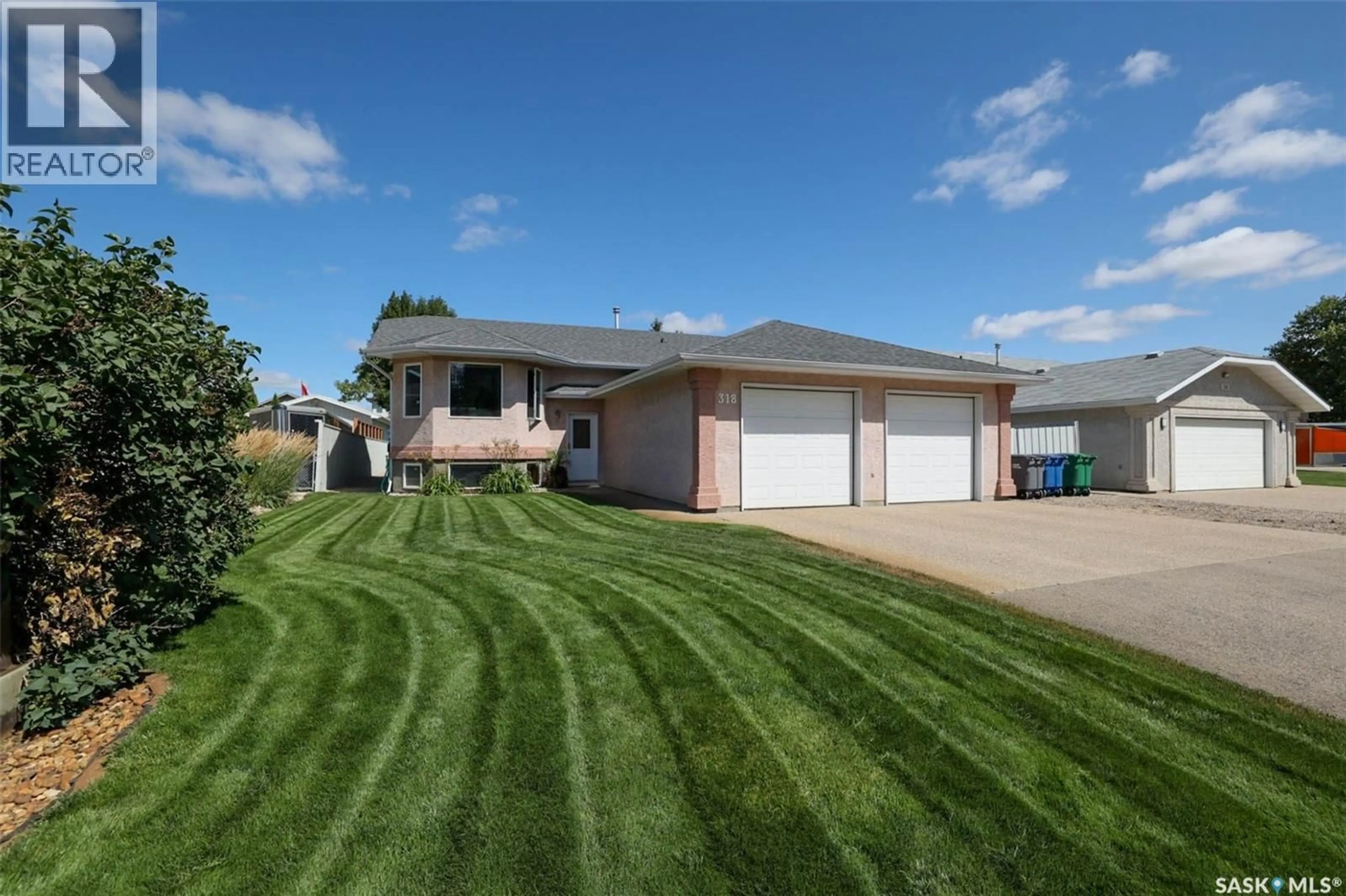 Home with vinyl exterior material, street for 318 HILLSIDE CRESCENT, Pilot Butte Saskatchewan S0G3Z0