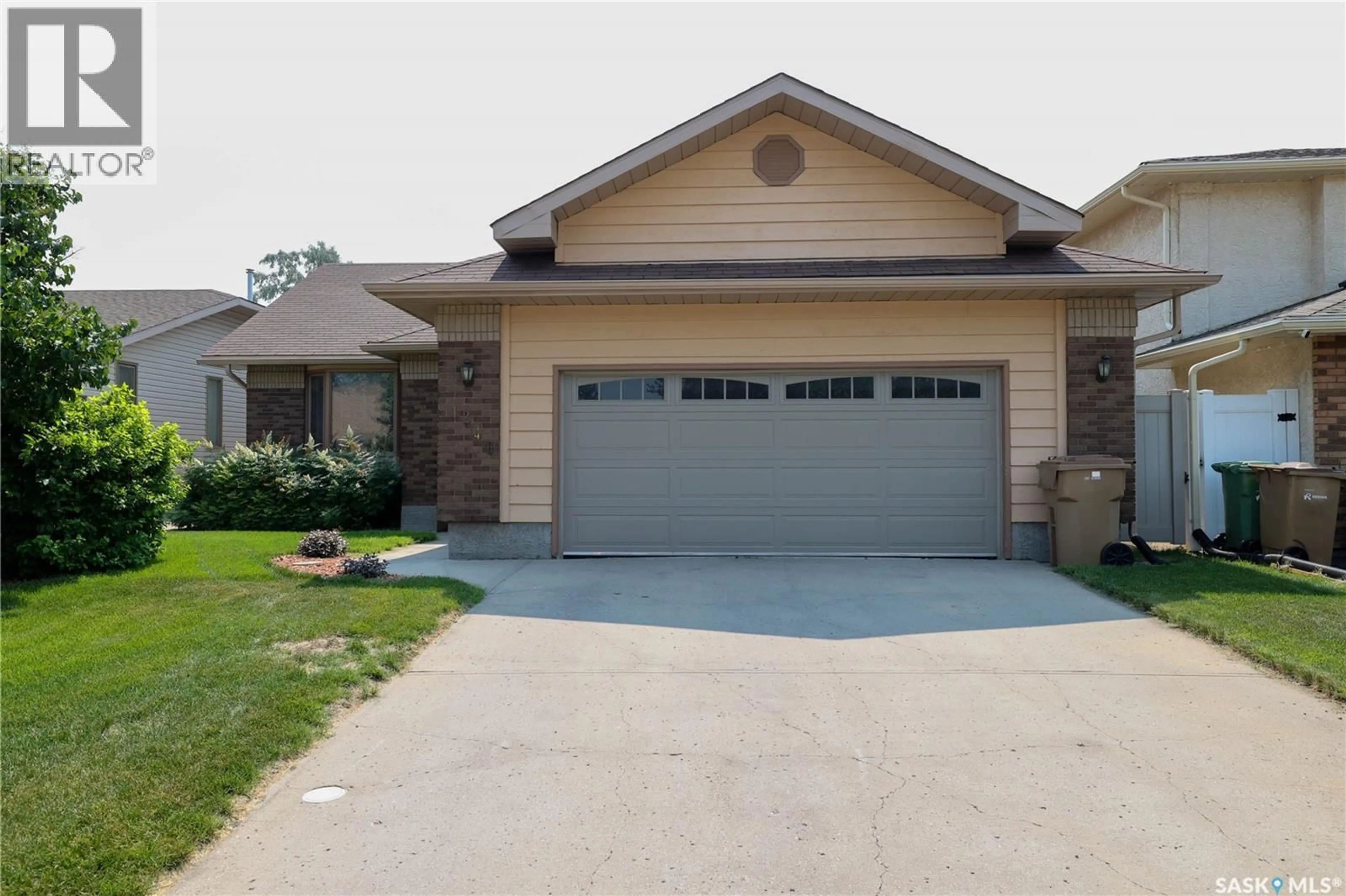 Home with brick exterior material, street for 1246 GLASSER BAY, Regina Saskatchewan S4X4K2