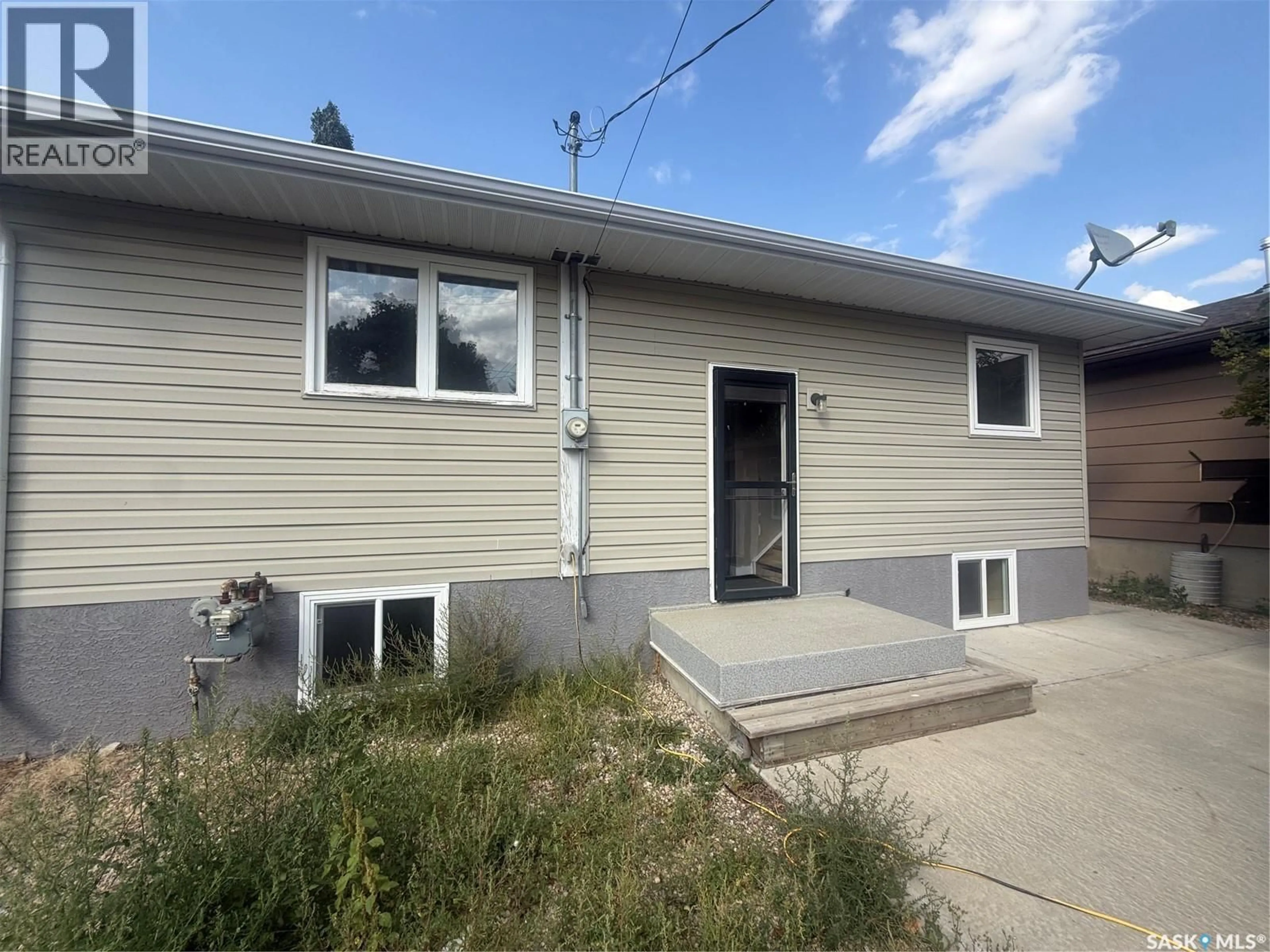 Home with vinyl exterior material, street for 411 5TH AVENUE, Assiniboia Saskatchewan S0H0B0