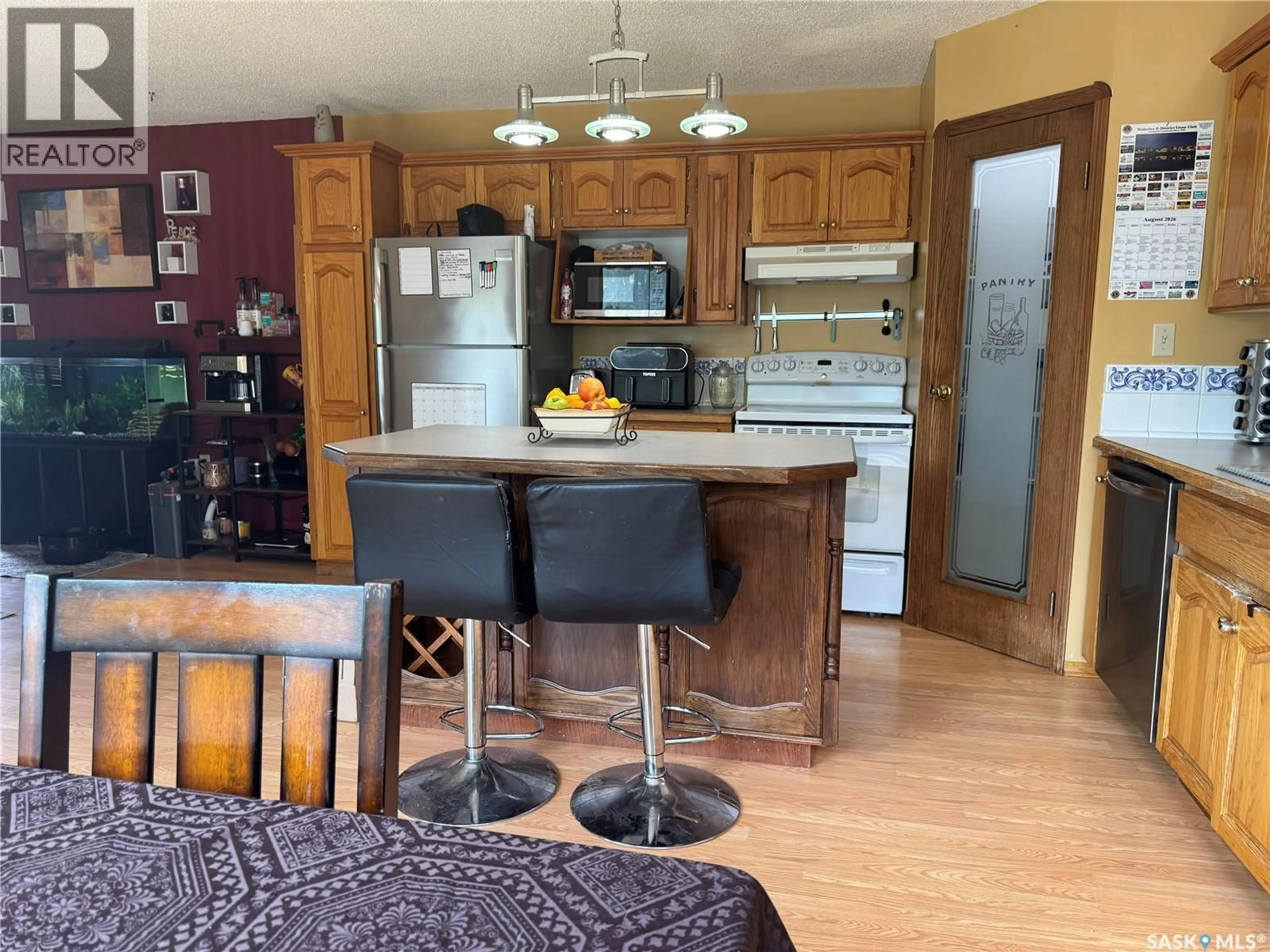 Open concept kitchen, wood/laminate floor for 401 POPLAR STREET, Wolseley Saskatchewan S0G5H0