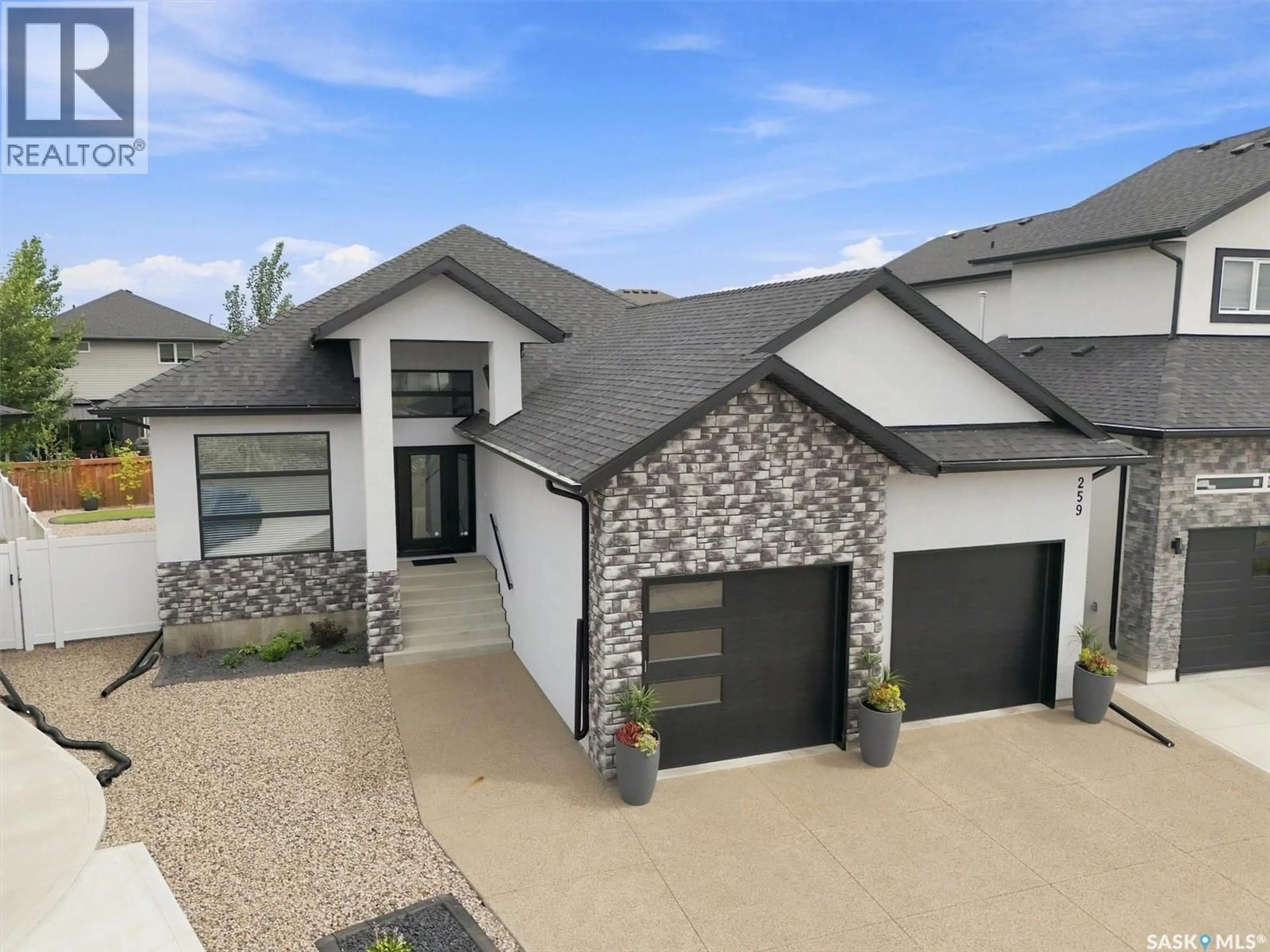 Home with brick exterior material, street for 259 FLYNN COVE, Saskatoon Saskatchewan S7V1R9