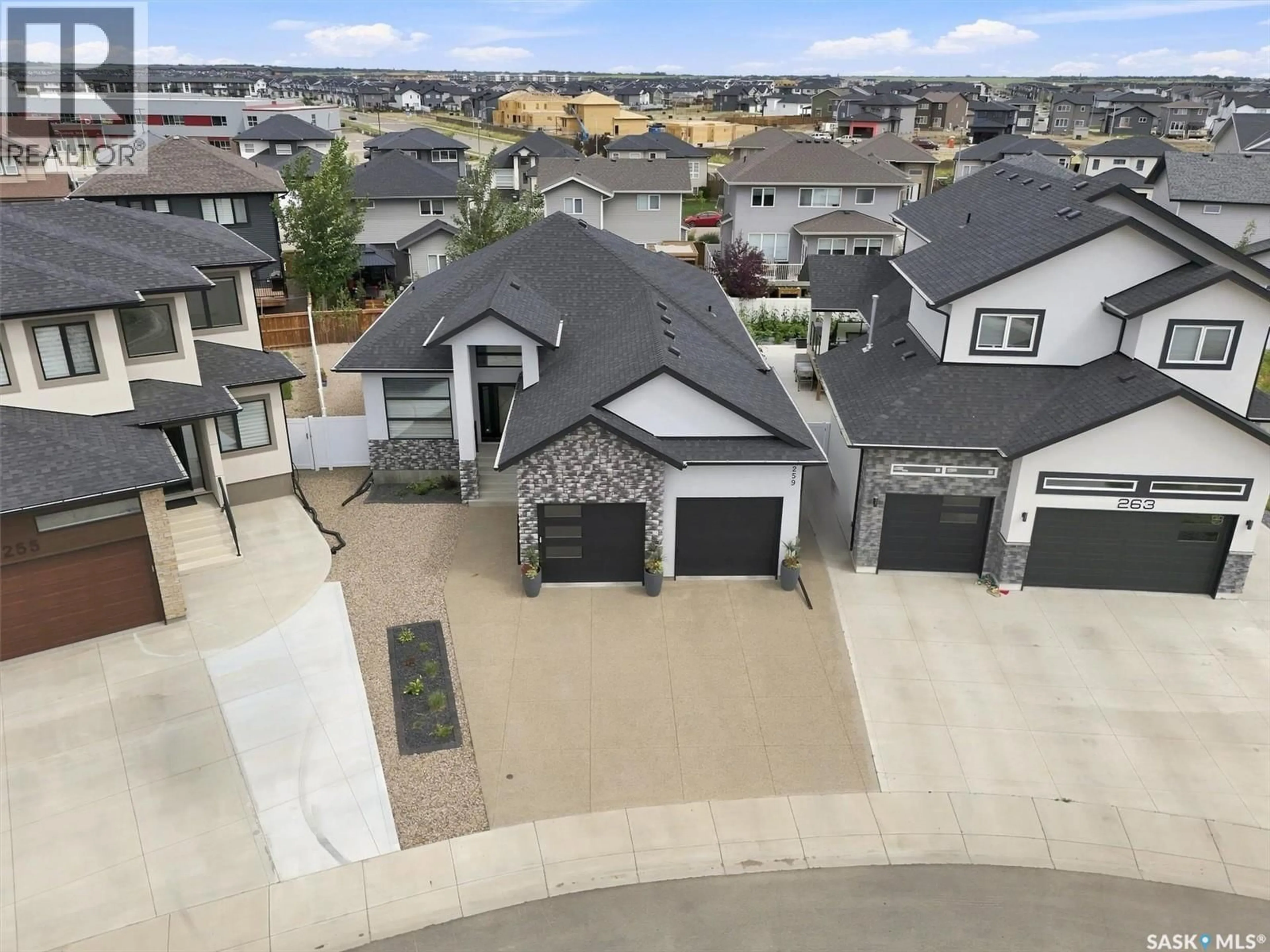 A pic from outside/outdoor area/front of a property/back of a property/a pic from drone, street for 259 FLYNN COVE, Saskatoon Saskatchewan S7V1R9