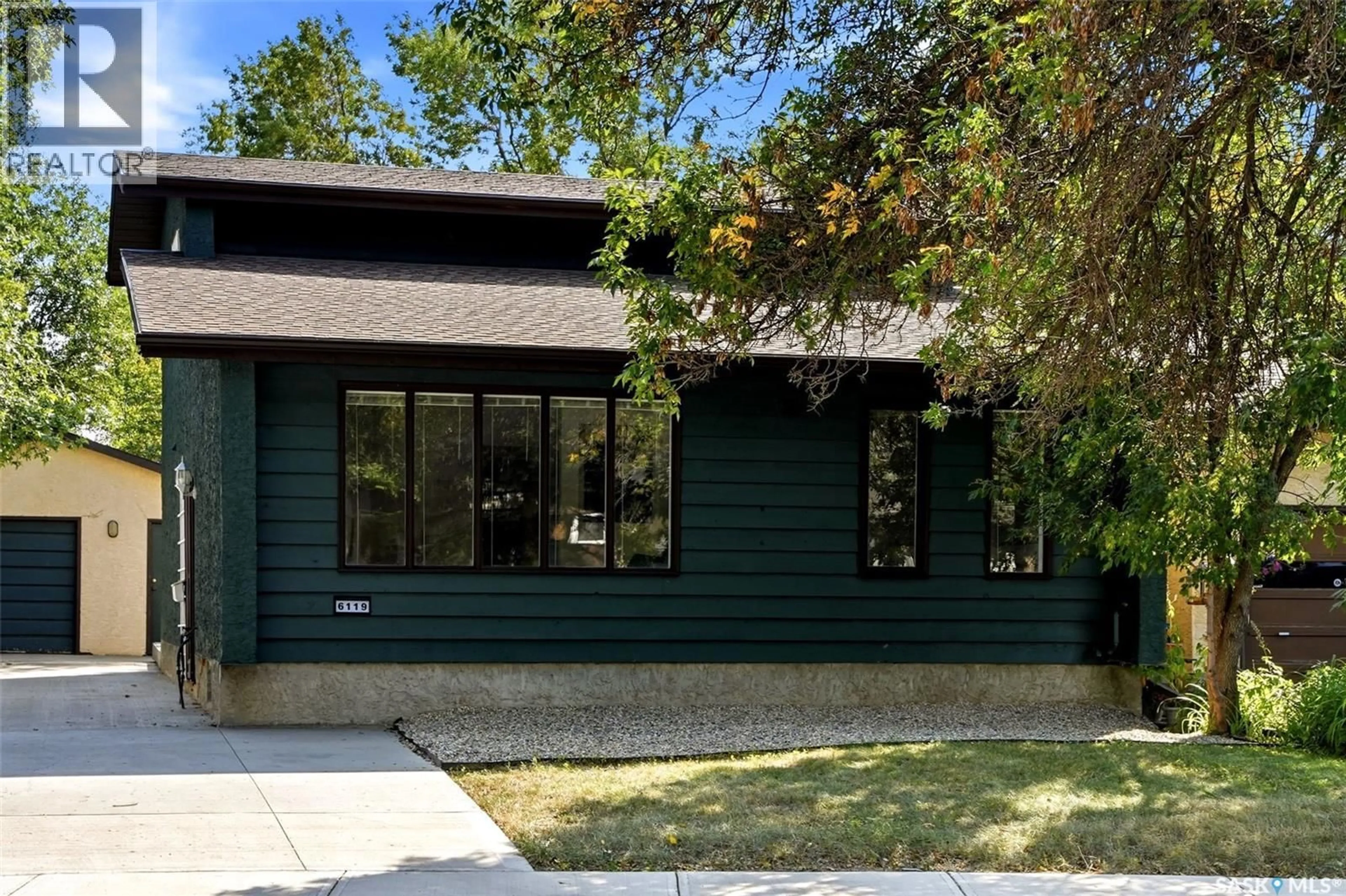 Home with brick exterior material, street for 6119 DALGLIESH DRIVE, Regina Saskatchewan S4X2K3