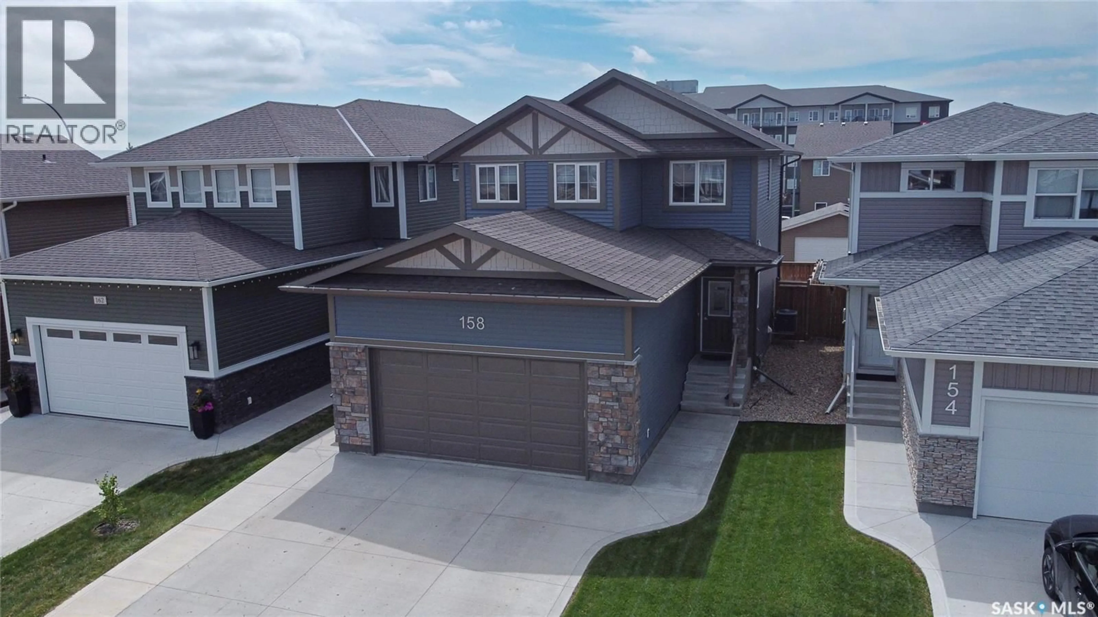 A pic from outside/outdoor area/front of a property/back of a property/a pic from drone, street for 158 COWAN CRESCENT, Martensville Saskatchewan S0K0A2