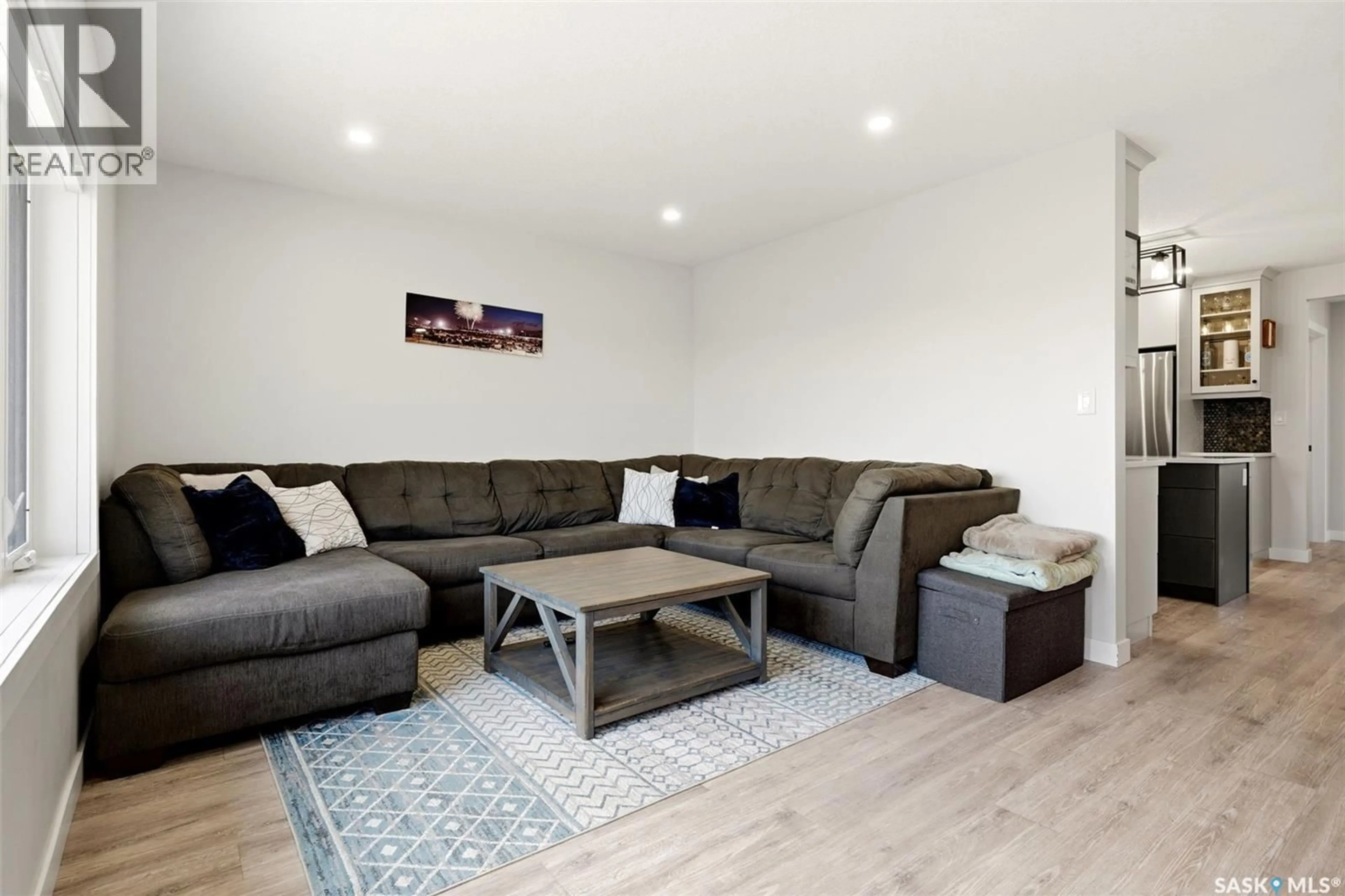 Living room with furniture, wood/laminate floor for HARDEN ACREAGE, South Qu'Appelle Rm No. 157 Saskatchewan S0G1K0
