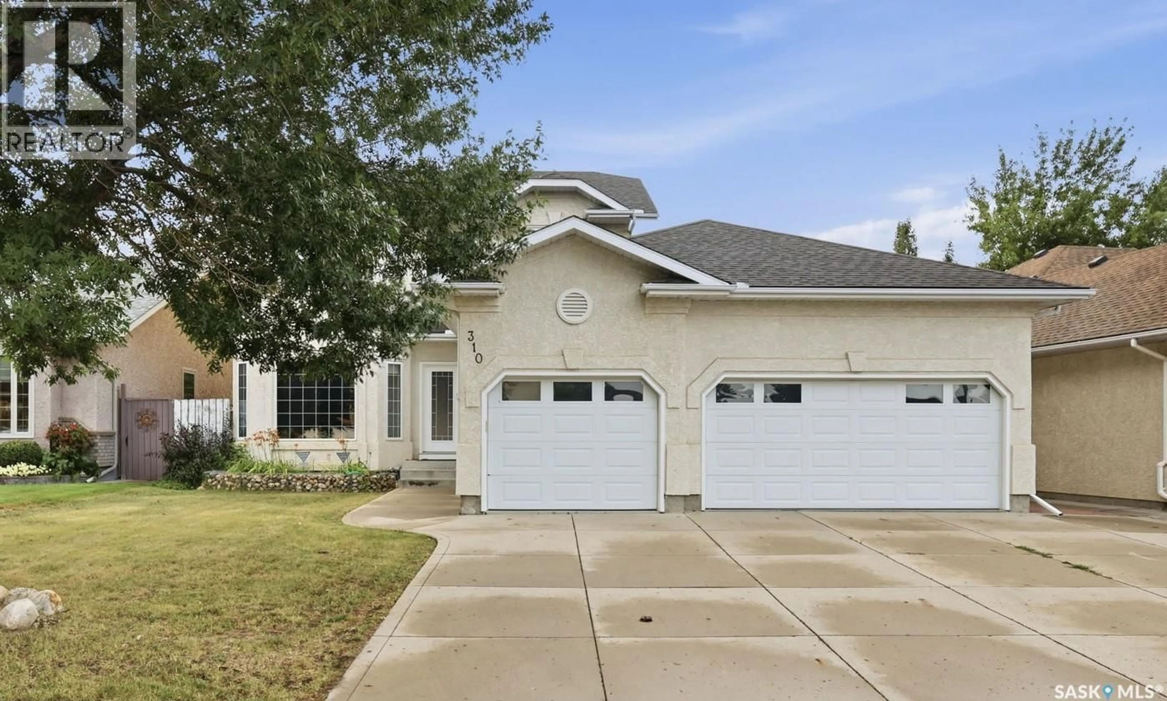 Home with vinyl exterior material, street for 310 CHOTEM CRESCENT, Saskatoon Saskatchewan S7N4M3