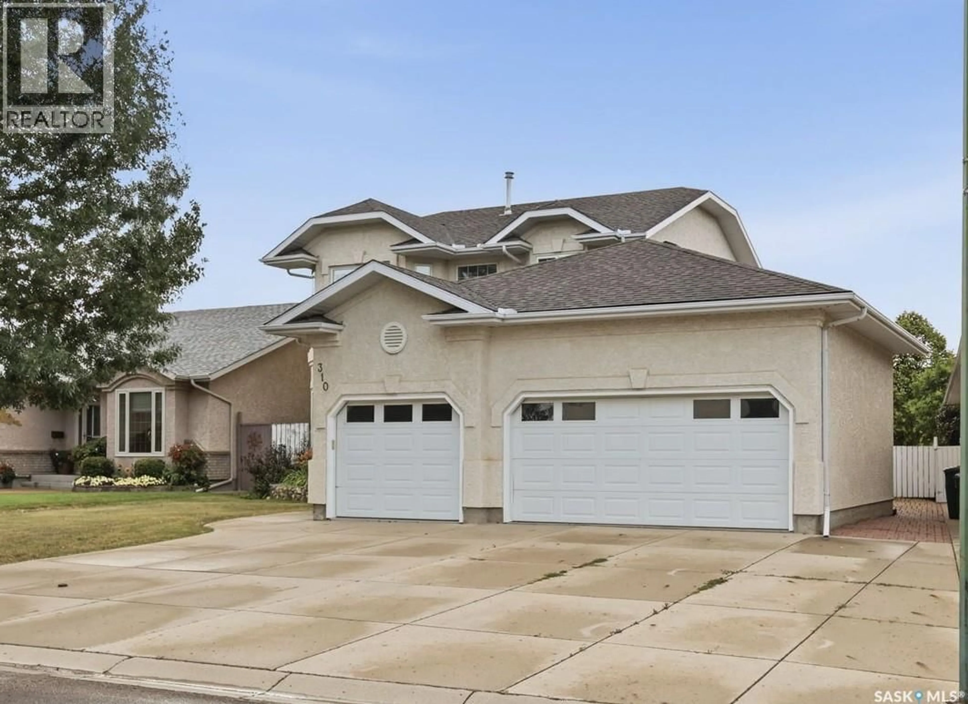 Home with vinyl exterior material, street for 310 CHOTEM CRESCENT, Saskatoon Saskatchewan S7N4M3