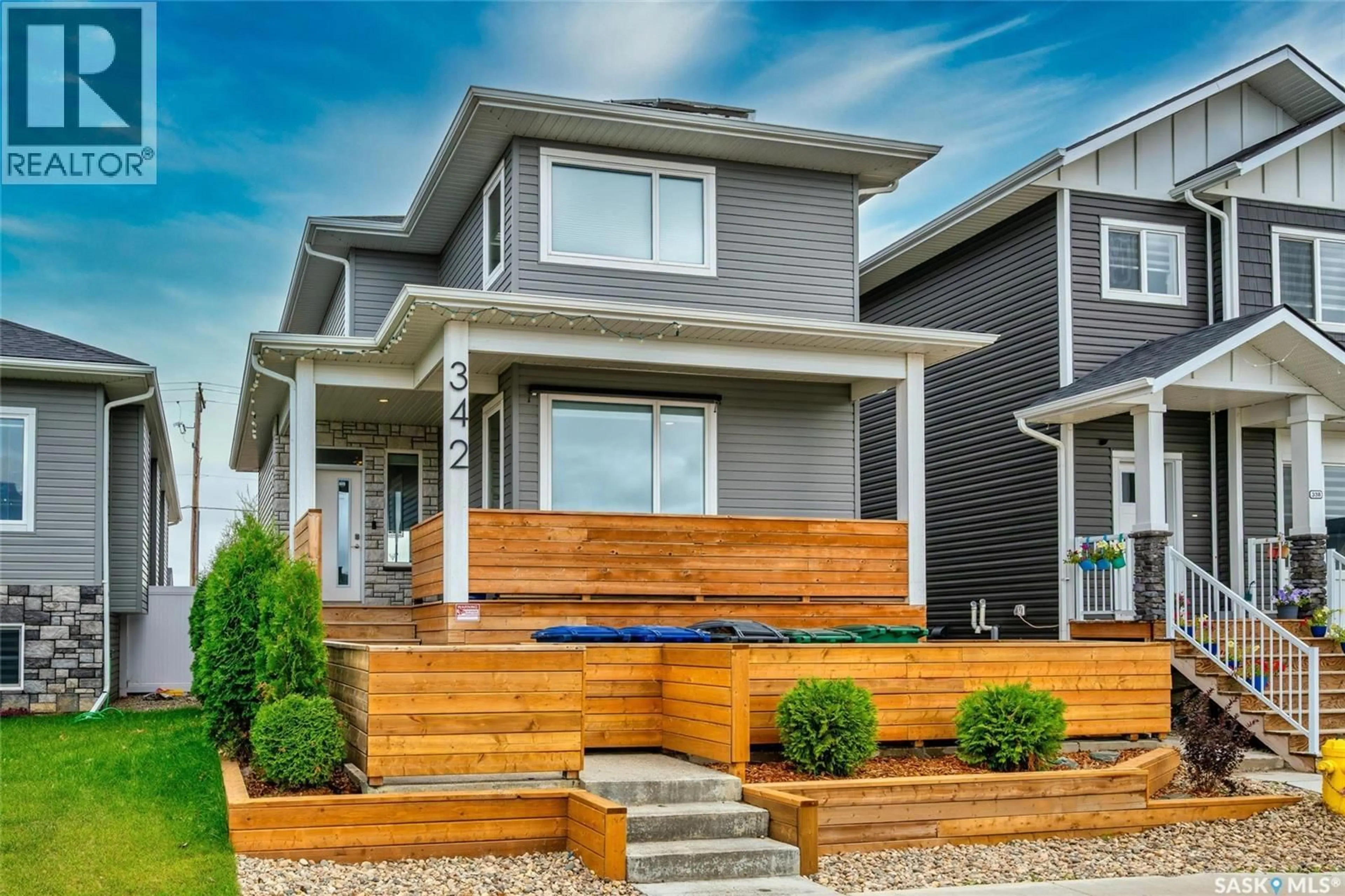 Home with vinyl exterior material, street for 342 KENASCHUK LANE, Saskatoon Saskatchewan S7W0Y5