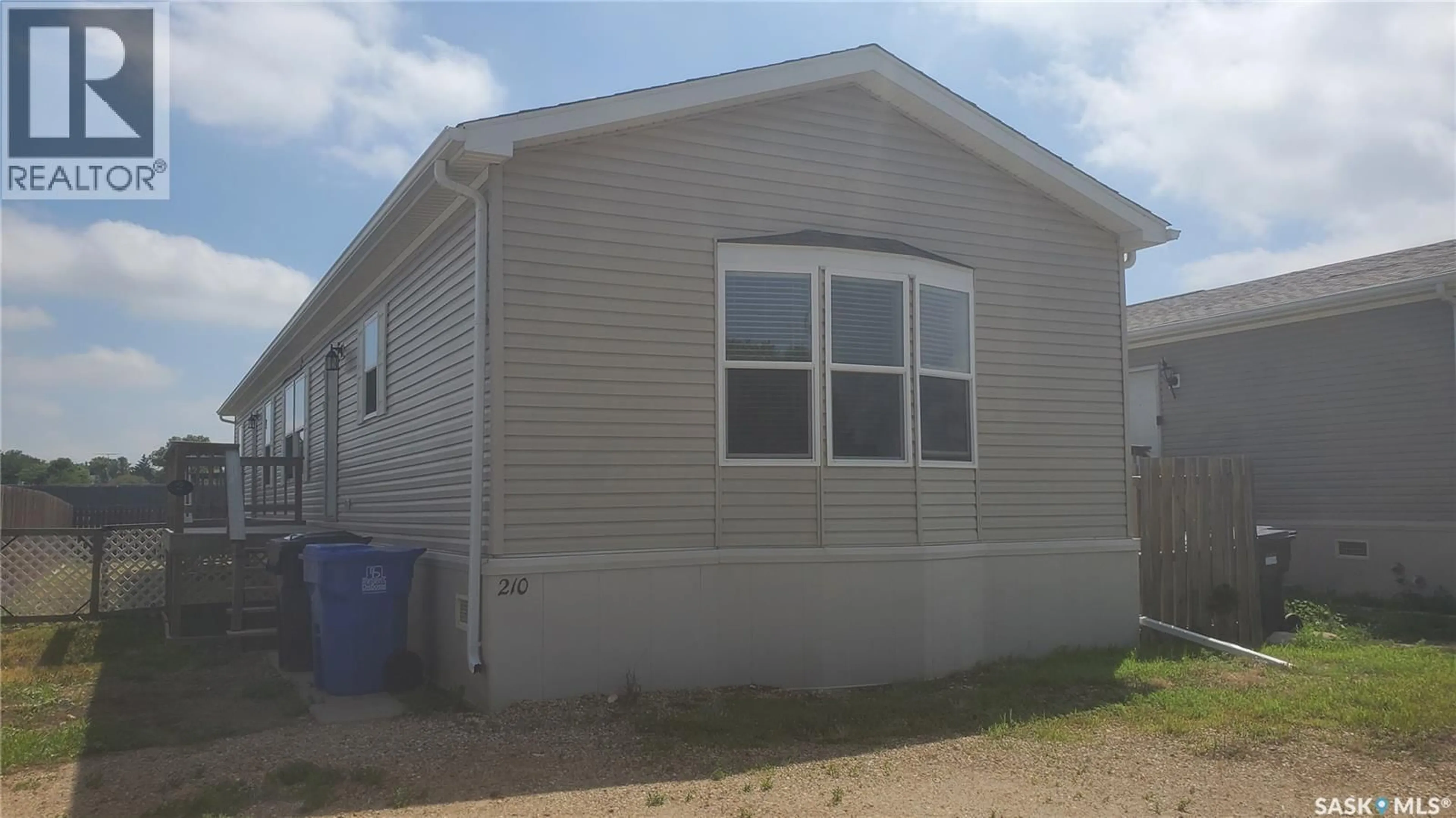 Home with vinyl exterior material, building for 210 BROWNLEE STREET, Weyburn Saskatchewan S4H3P4