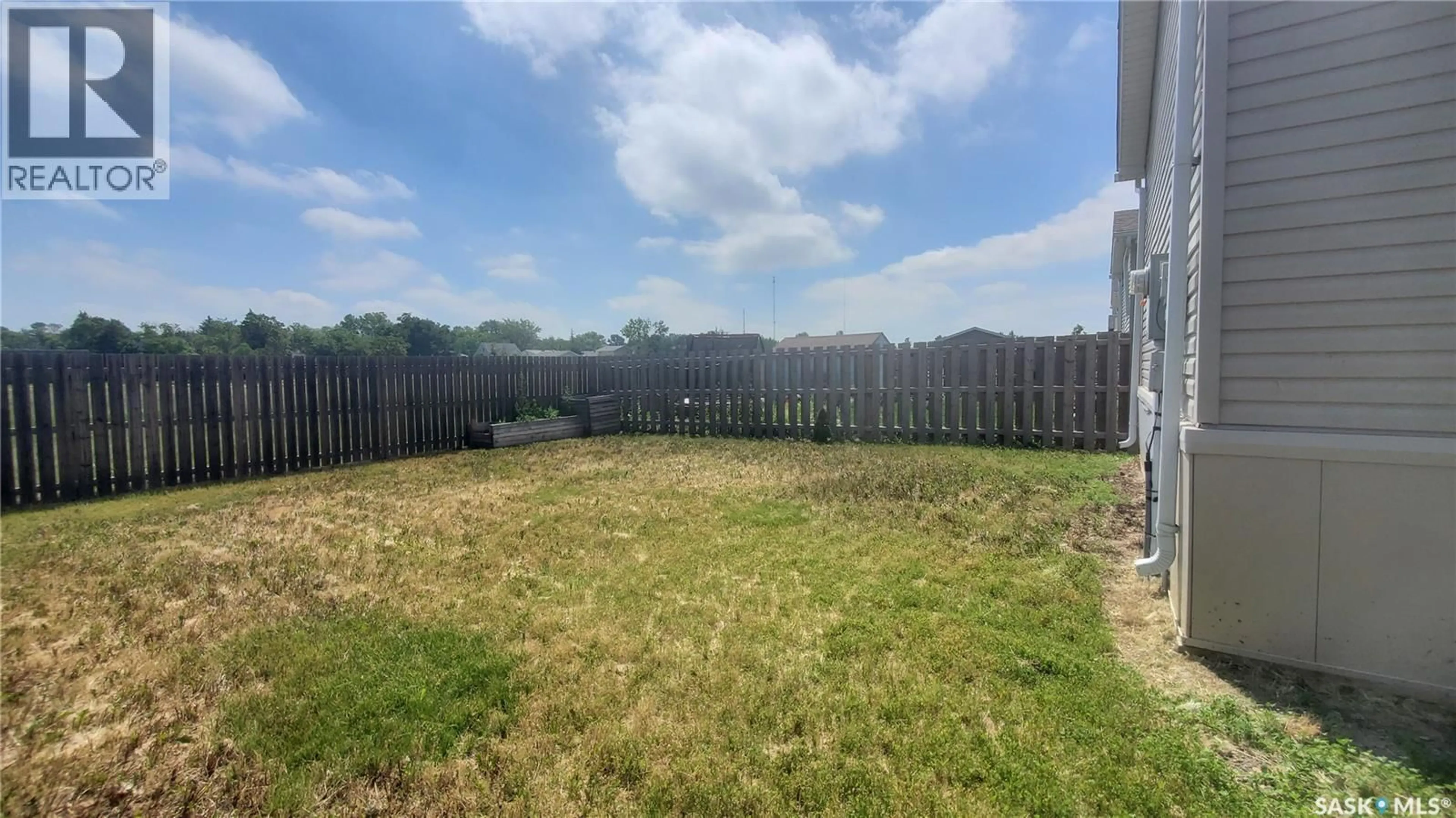 A pic from outside/outdoor area/front of a property/back of a property/a pic from drone, unknown for 210 BROWNLEE STREET, Weyburn Saskatchewan S4H3P4