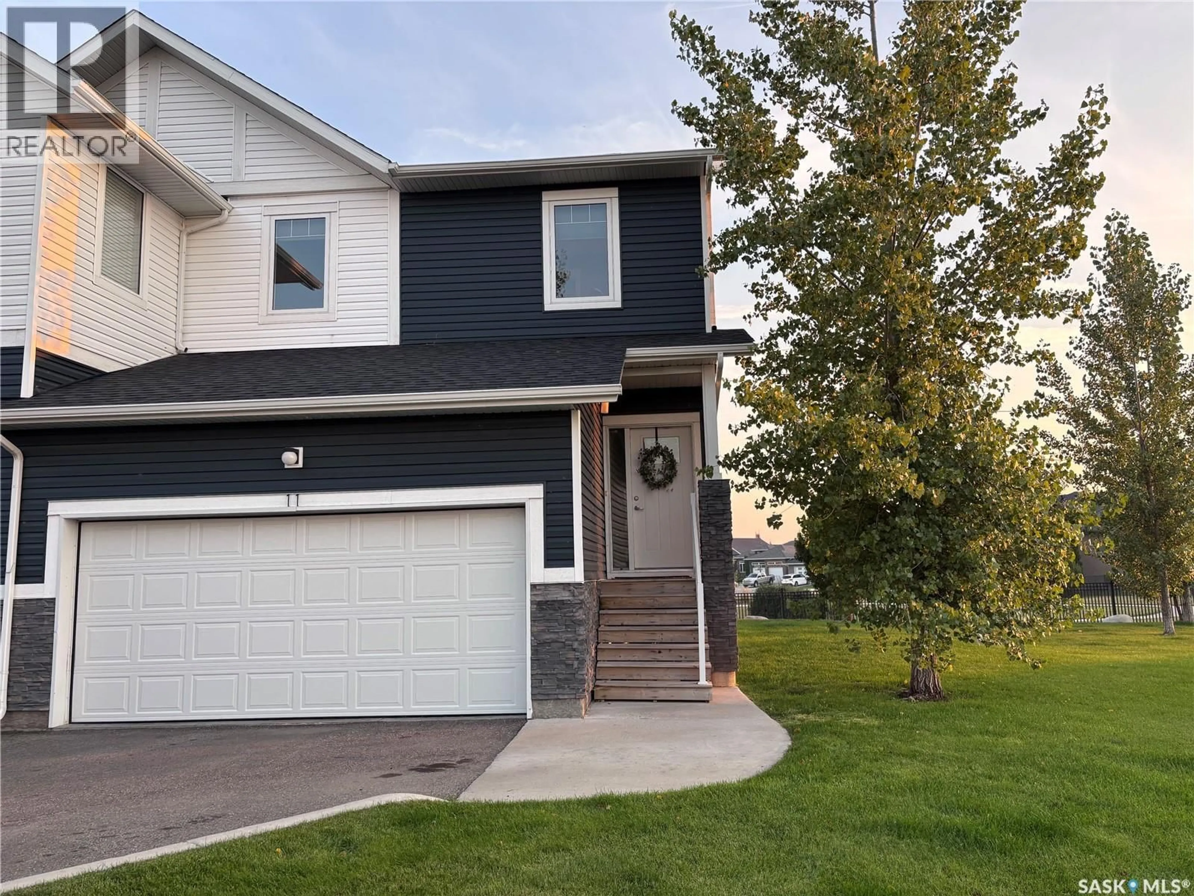 Home with vinyl exterior material, street for 11 510 KLOPPENBURG CRESCENT, Saskatoon Saskatchewan S7W0X8