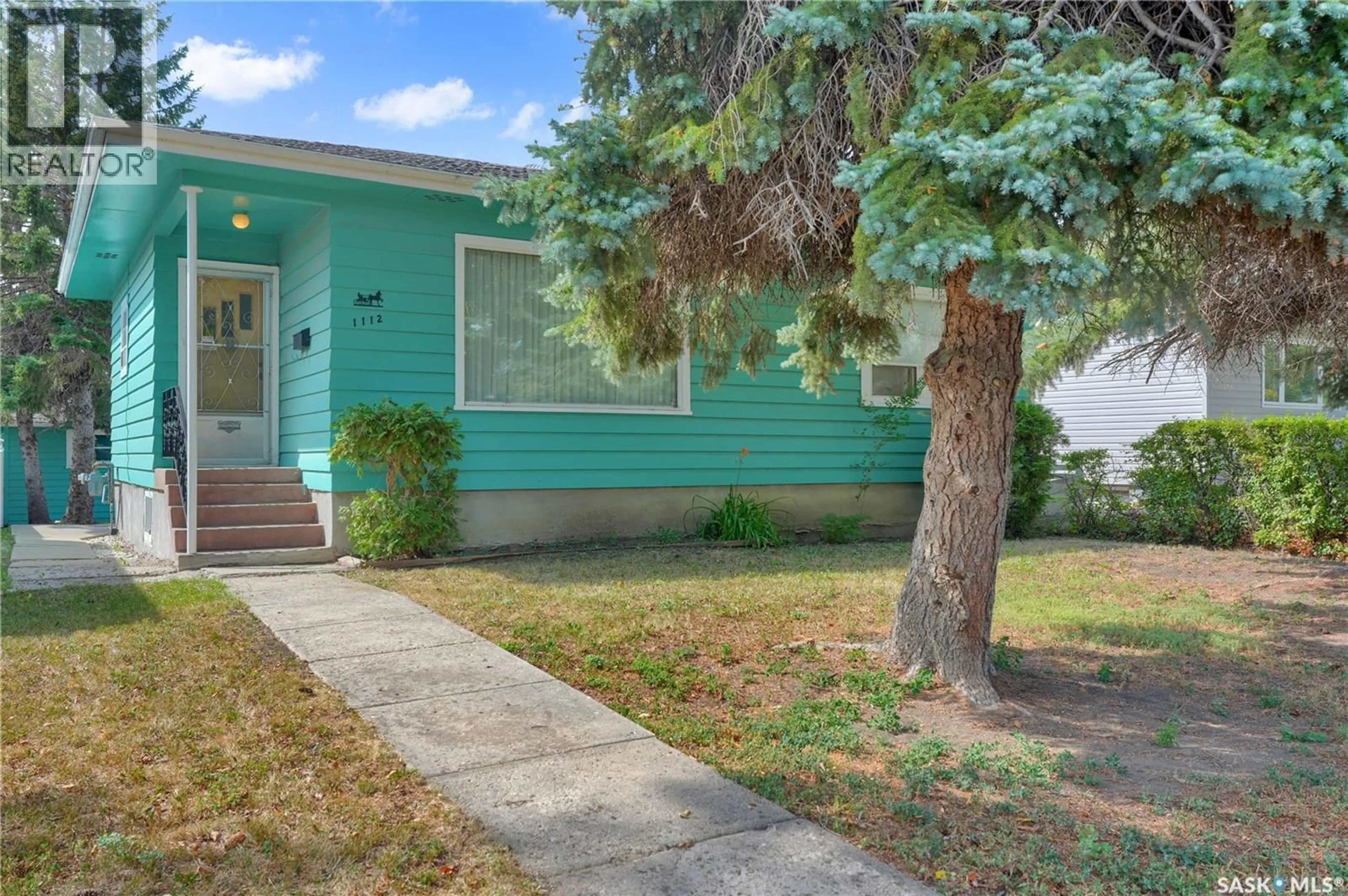 Home with vinyl exterior material, street for 1112 HORACE STREET, Regina Saskatchewan S4T5L4