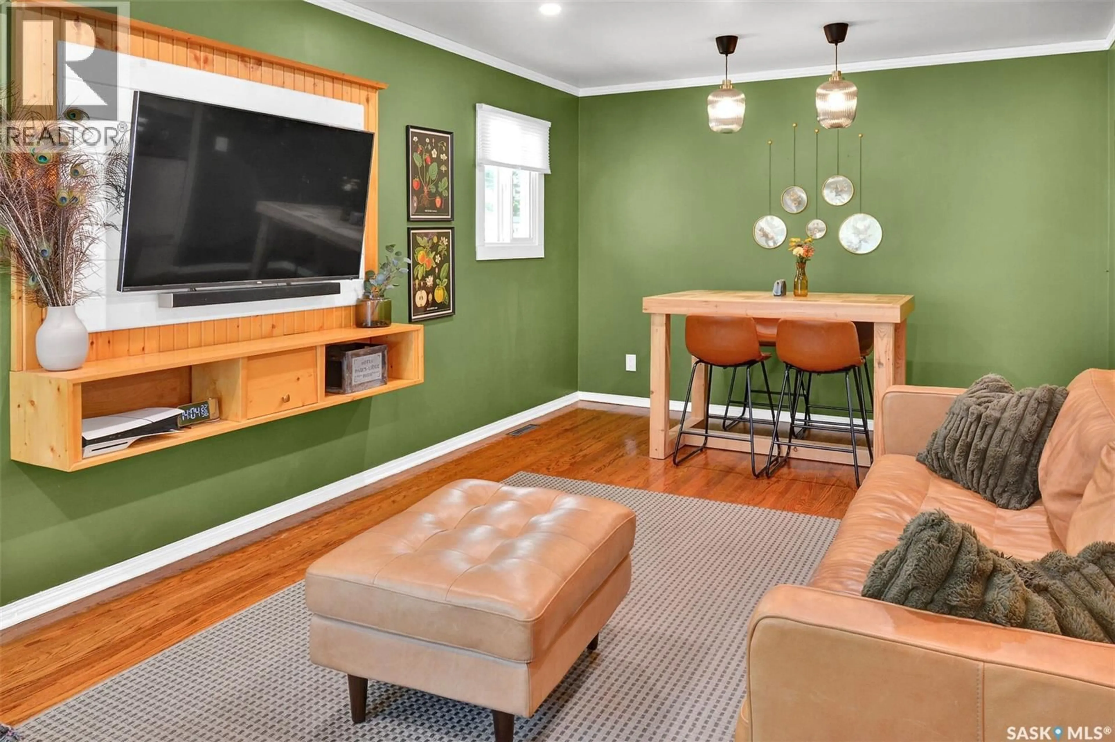 Living room with furniture, wood/laminate floor for 816 4TH STREET, Saskatoon Saskatchewan S7H1K4