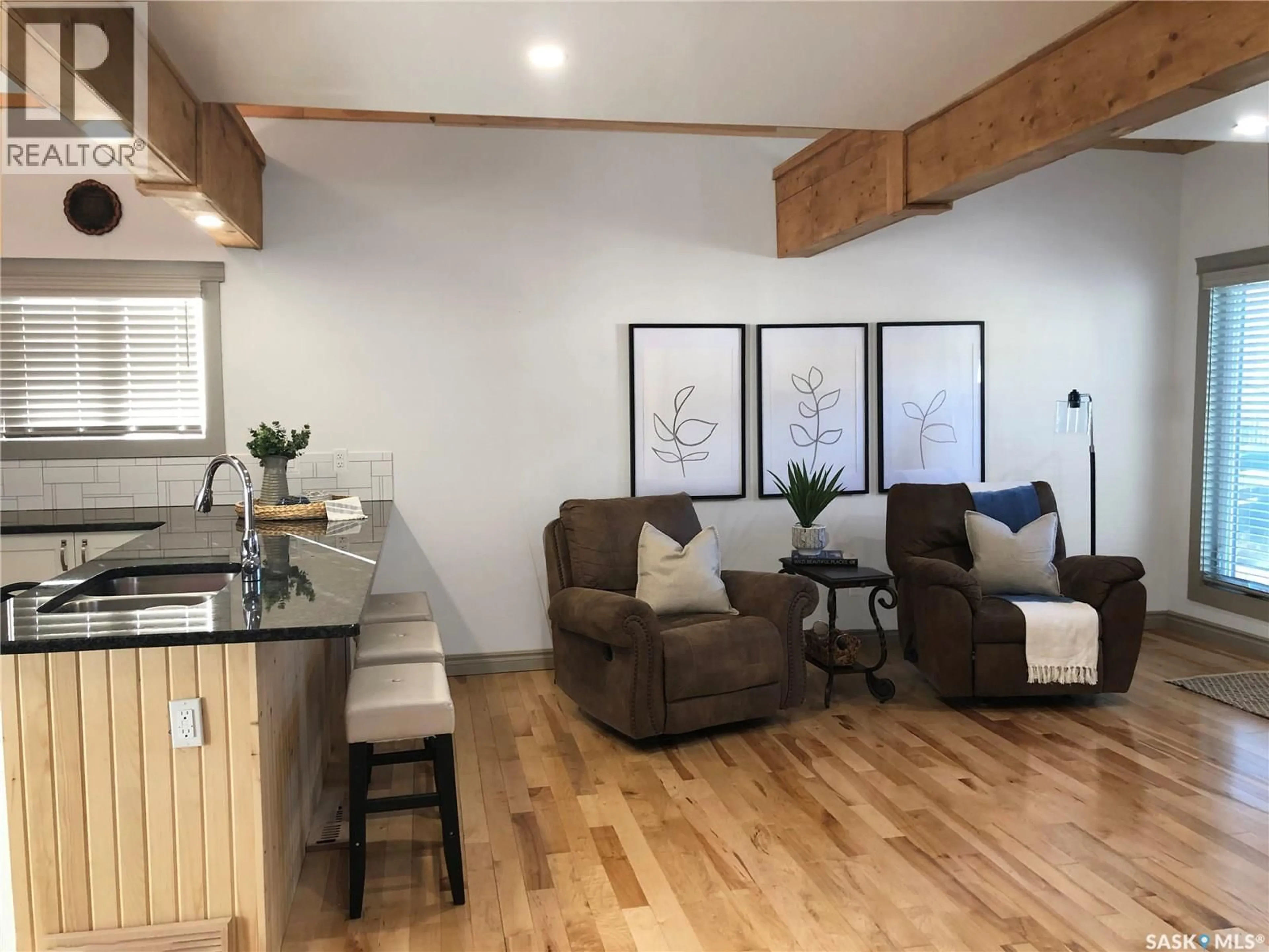 Open concept kitchen, wood/laminate floor for 707 RAILWAY STREET, Swift Current Saskatchewan S9H1E1