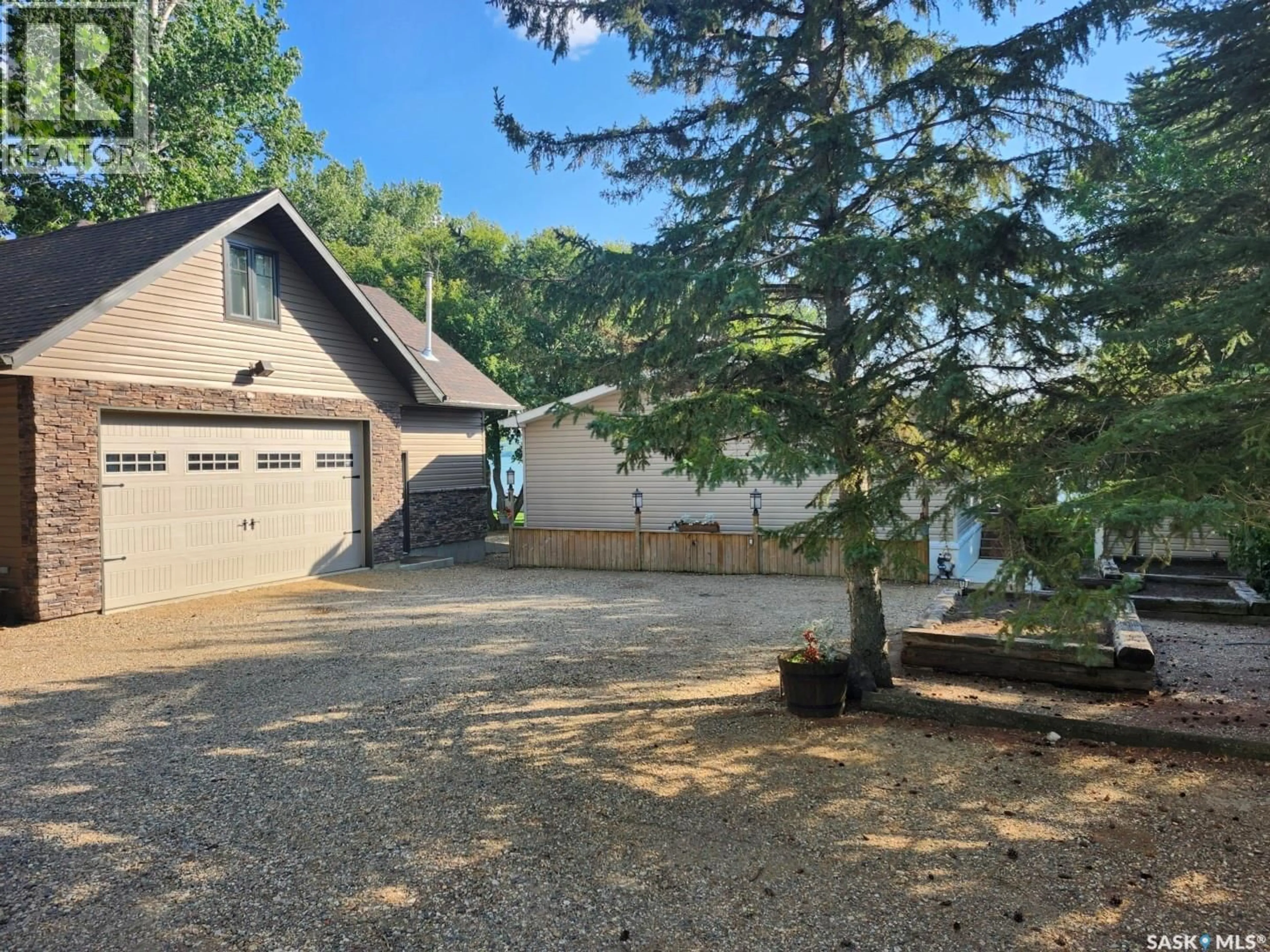 A pic from outside/outdoor area/front of a property/back of a property/a pic from drone, water/lake/river/ocean view for 309-310 DANIEL DRIVE, Buffalo Pound Lake Saskatchewan S0G0H0