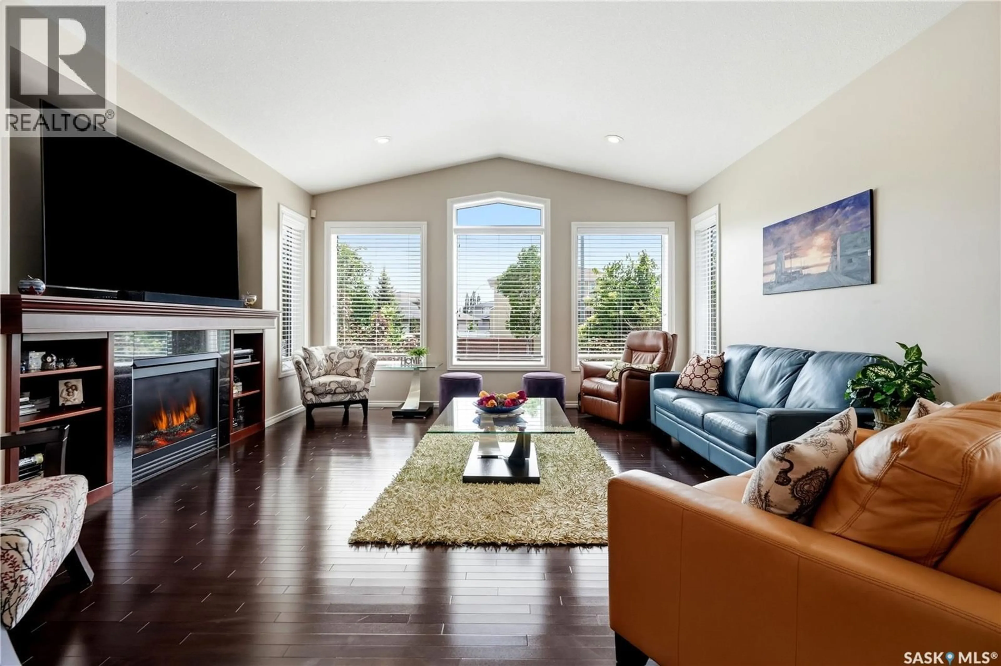Living room with furniture, wood/laminate floor for 6178 WASCANA COURT WAY, Regina Saskatchewan S4V3E8