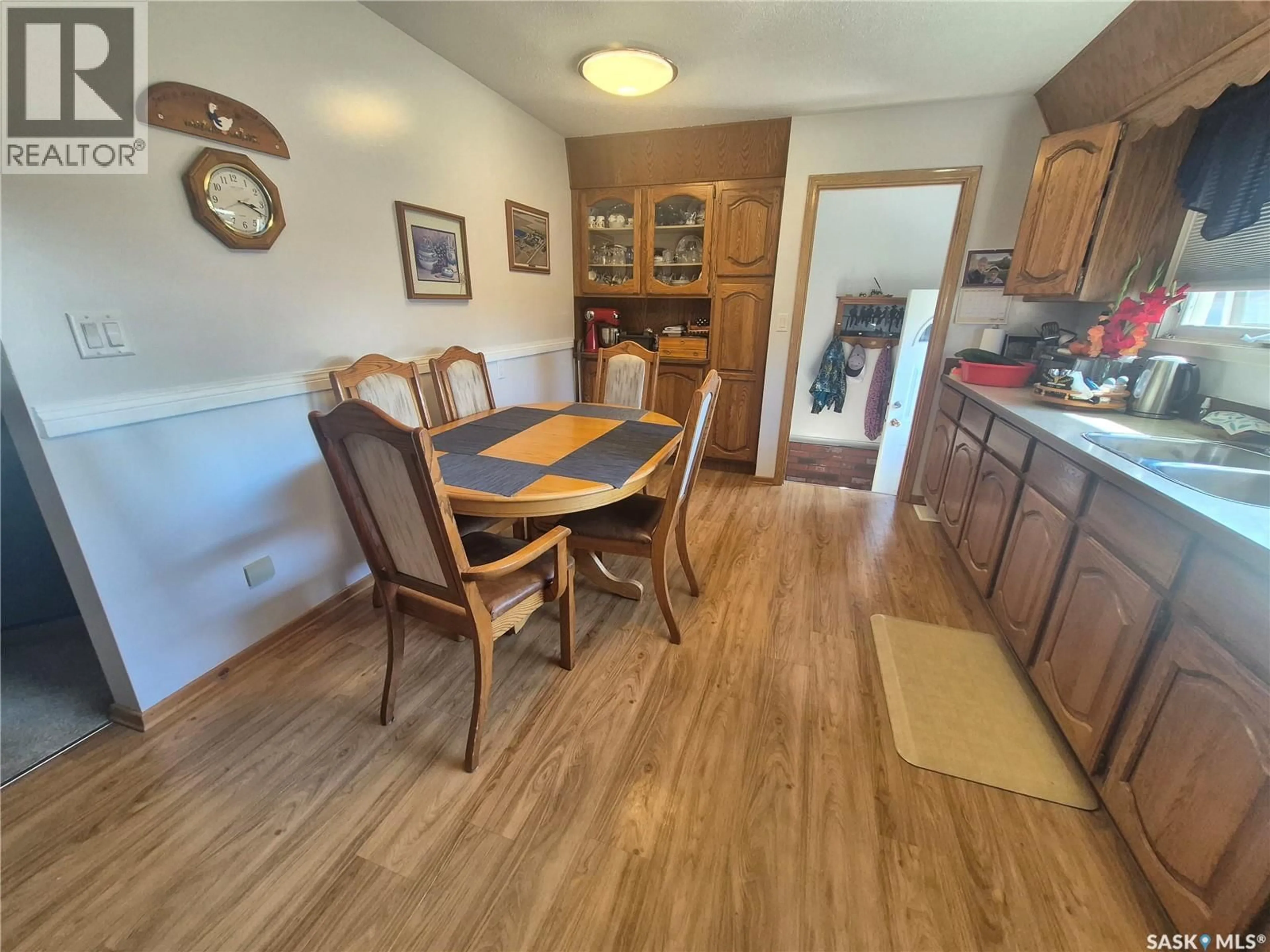 Dining room, wood/laminate floor for 202 BRADLEY STREET, Ogema Saskatchewan S0C1Y0