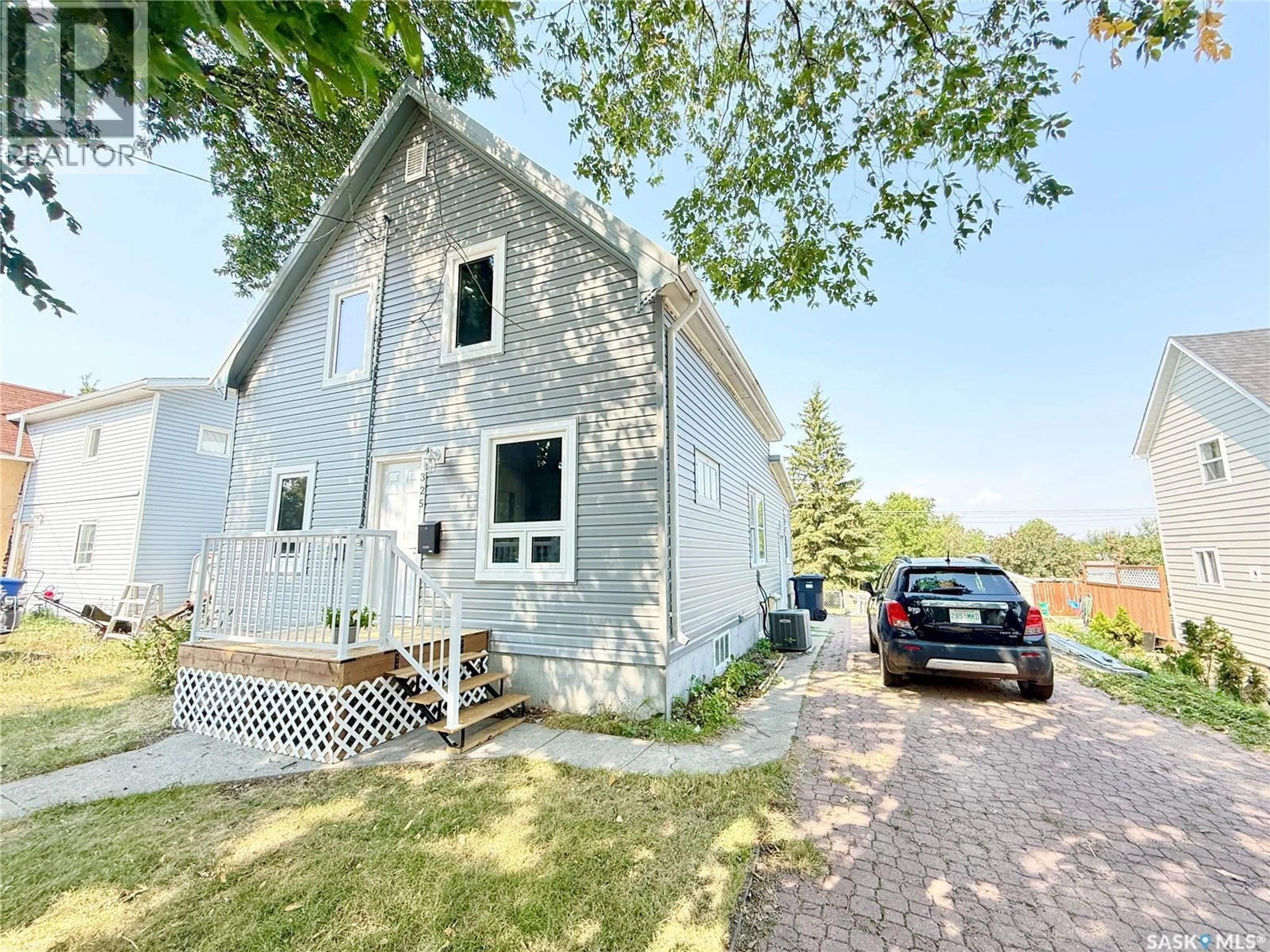 A pic from outside/outdoor area/front of a property/back of a property/a pic from drone, street for 325 3RD AVENUE, Weyburn Saskatchewan S4H1X5