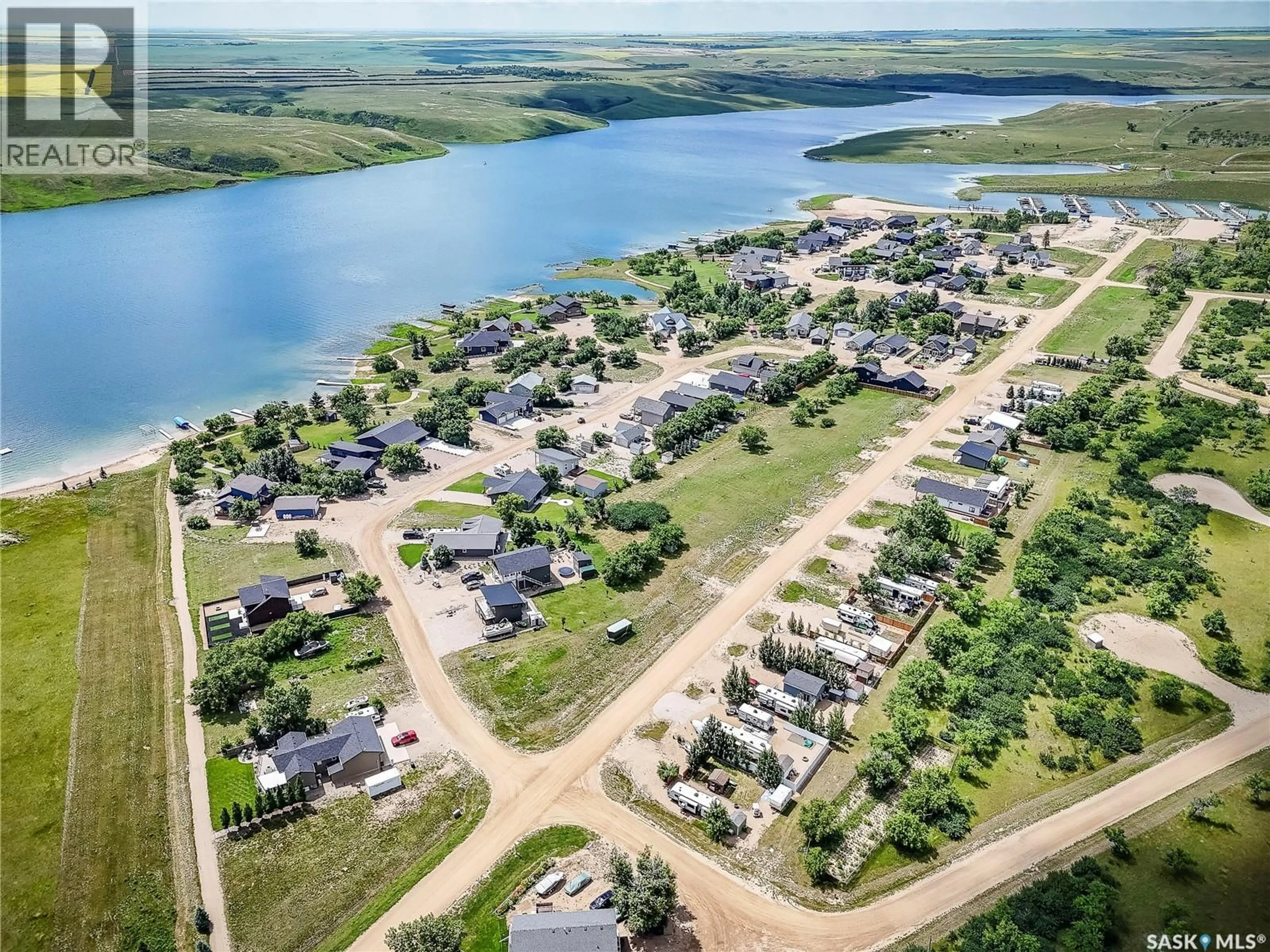 A pic from outside/outdoor area/front of a property/back of a property/a pic from drone, water/lake/river/ocean view for 36 WILLOW LANE, Diefenbaker Lake Saskatchewan S0L2E0