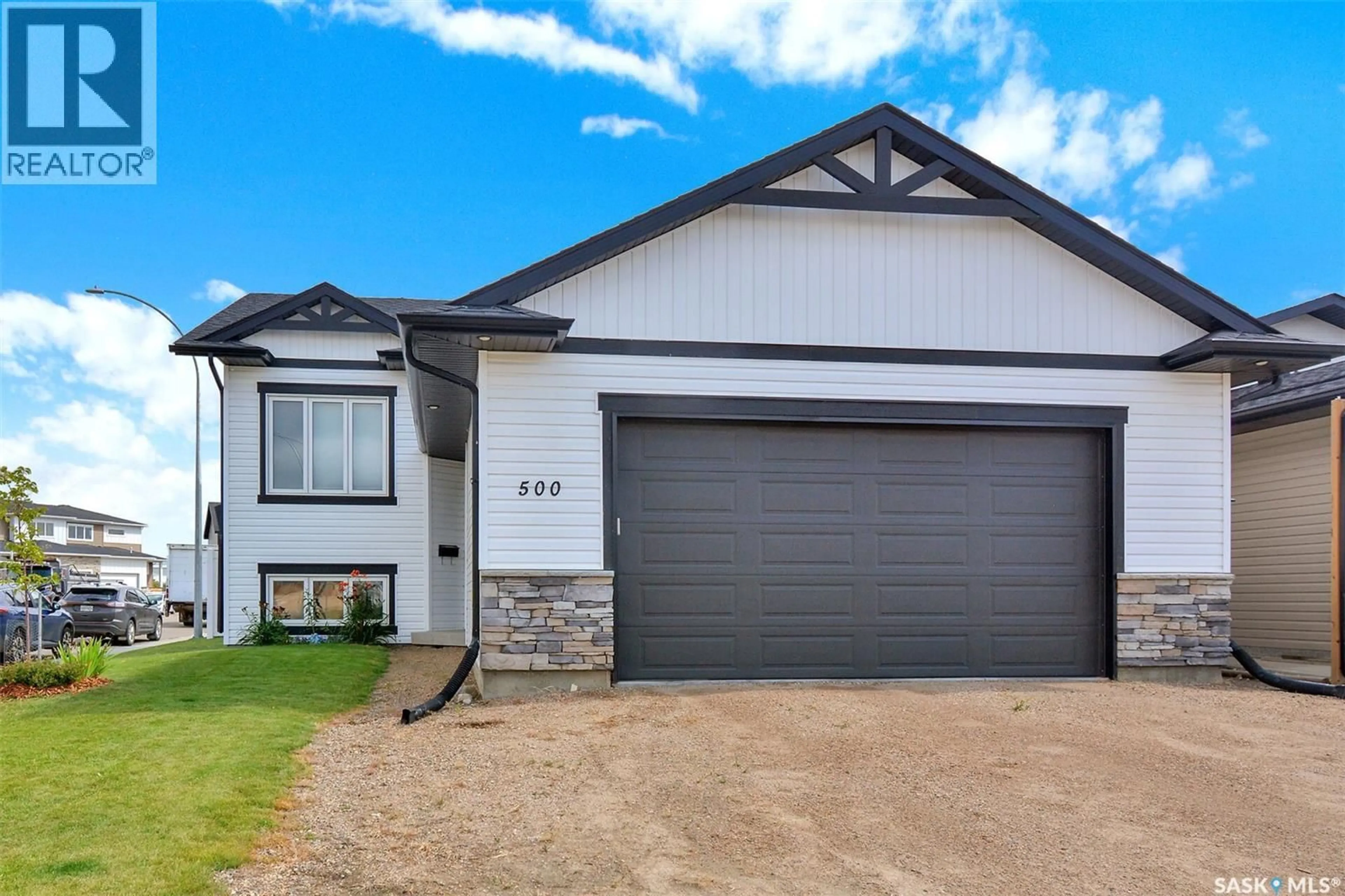 Home with vinyl exterior material, street for 500 FROESE STREET, Warman Saskatchewan S0K4S3