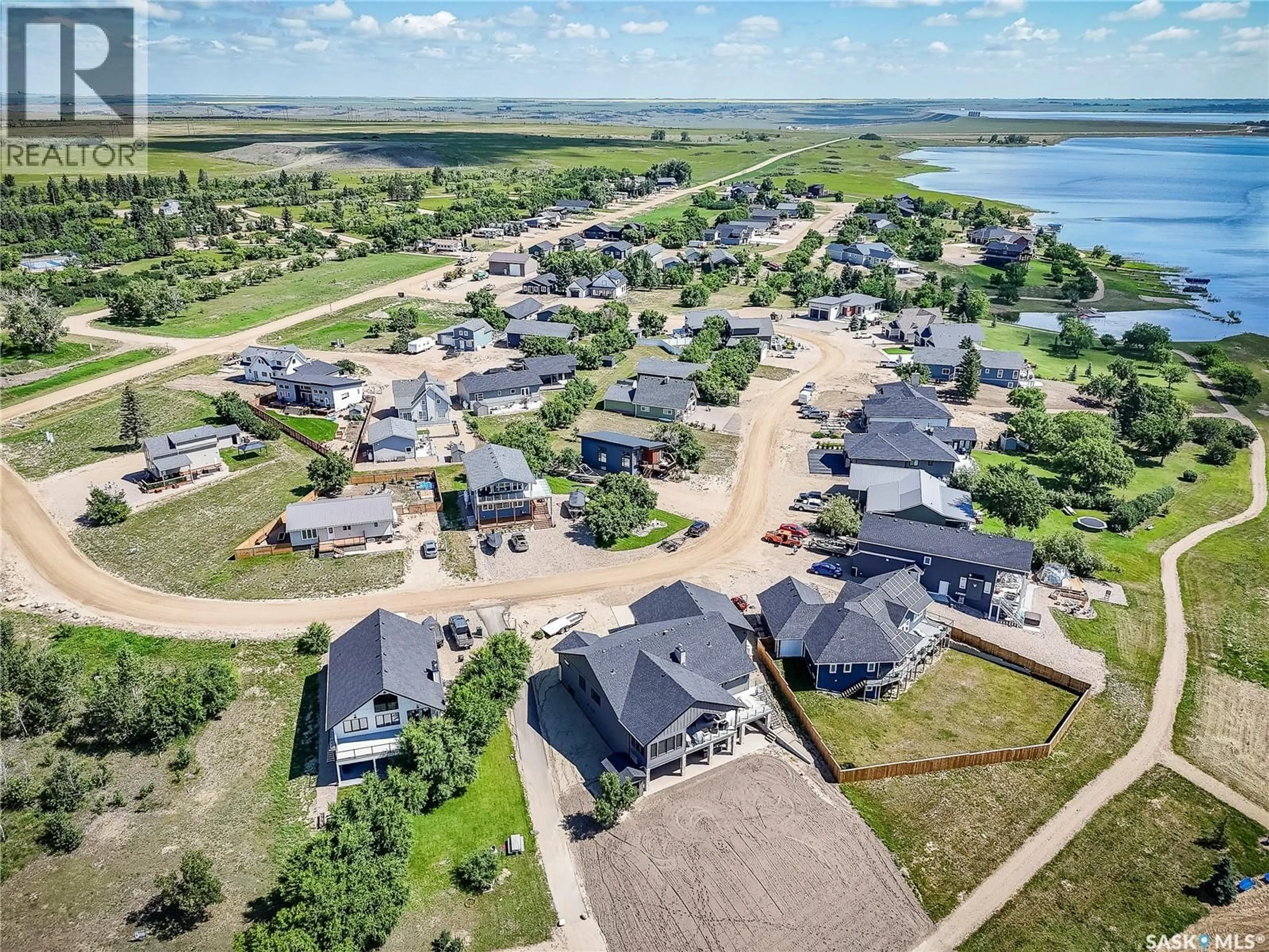 A pic from outside/outdoor area/front of a property/back of a property/a pic from drone, water/lake/river/ocean view for 38 WILLOW LANE, Diefenbaker Lake Saskatchewan S0L2E0