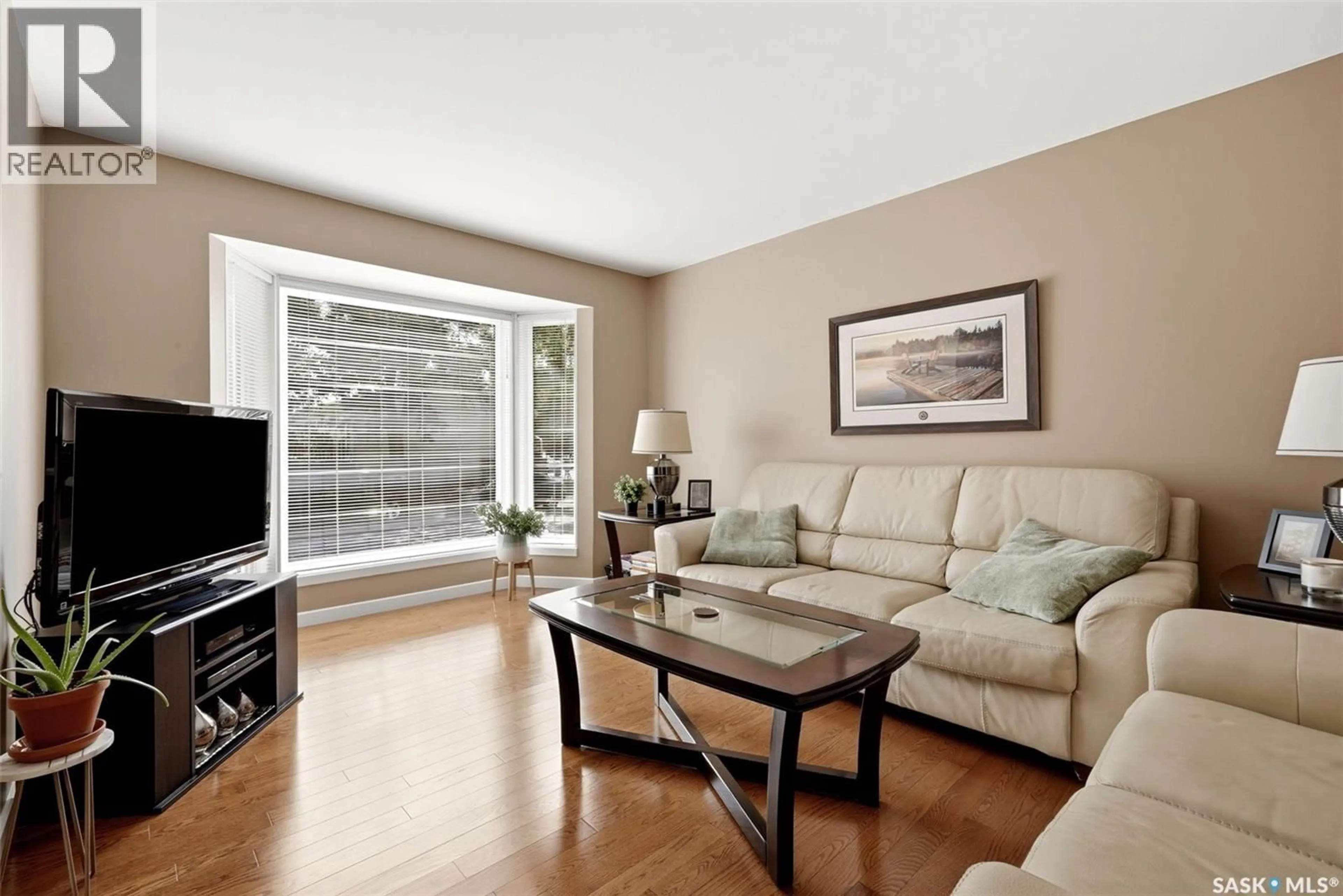 Living room with furniture, wood/laminate floor for 906 HOPKINS CRESCENT, Regina Saskatchewan S4X2N3
