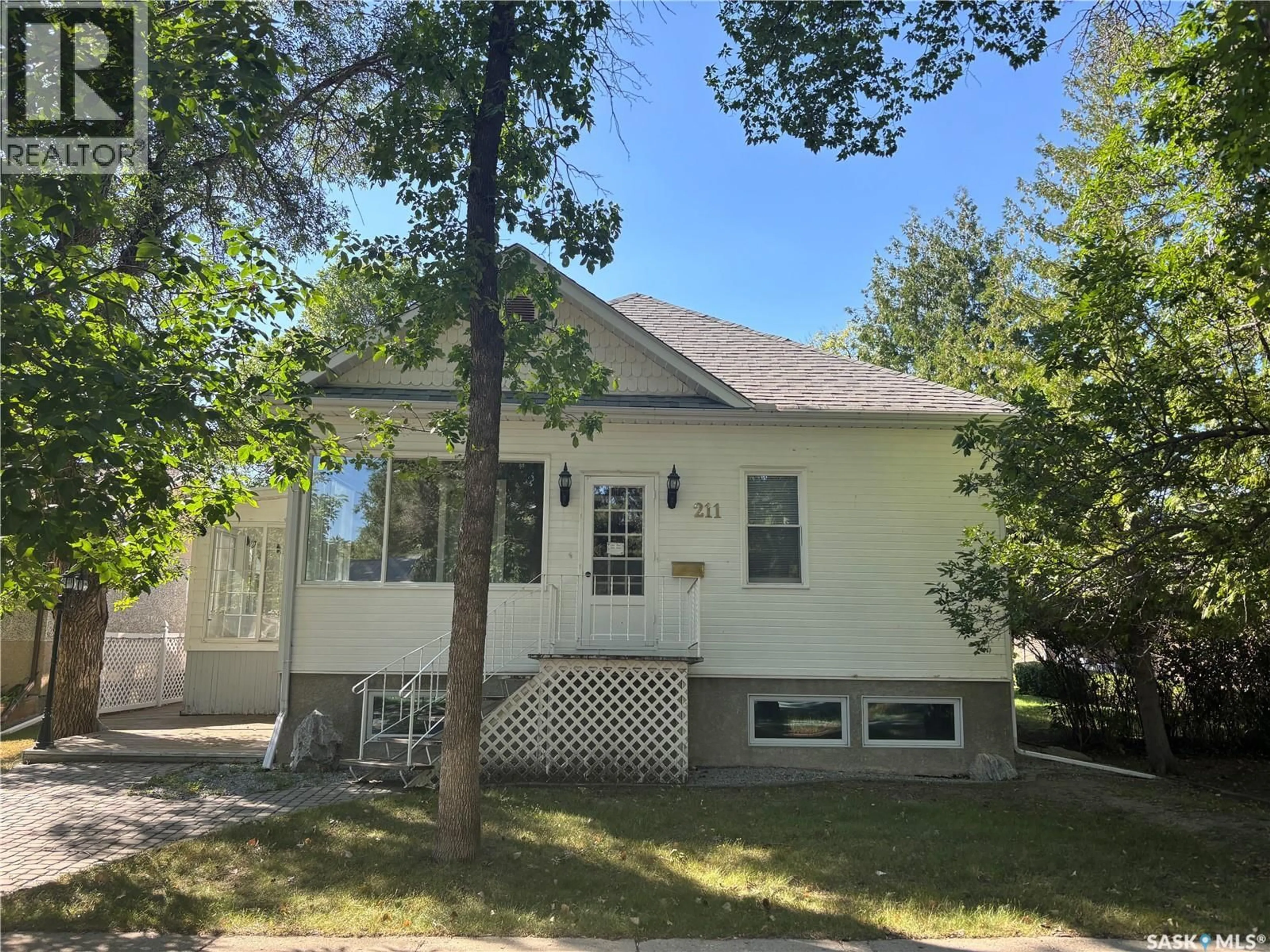 Home with vinyl exterior material, street for 211 ASPEN STREET, Maple Creek Saskatchewan S0N1N0