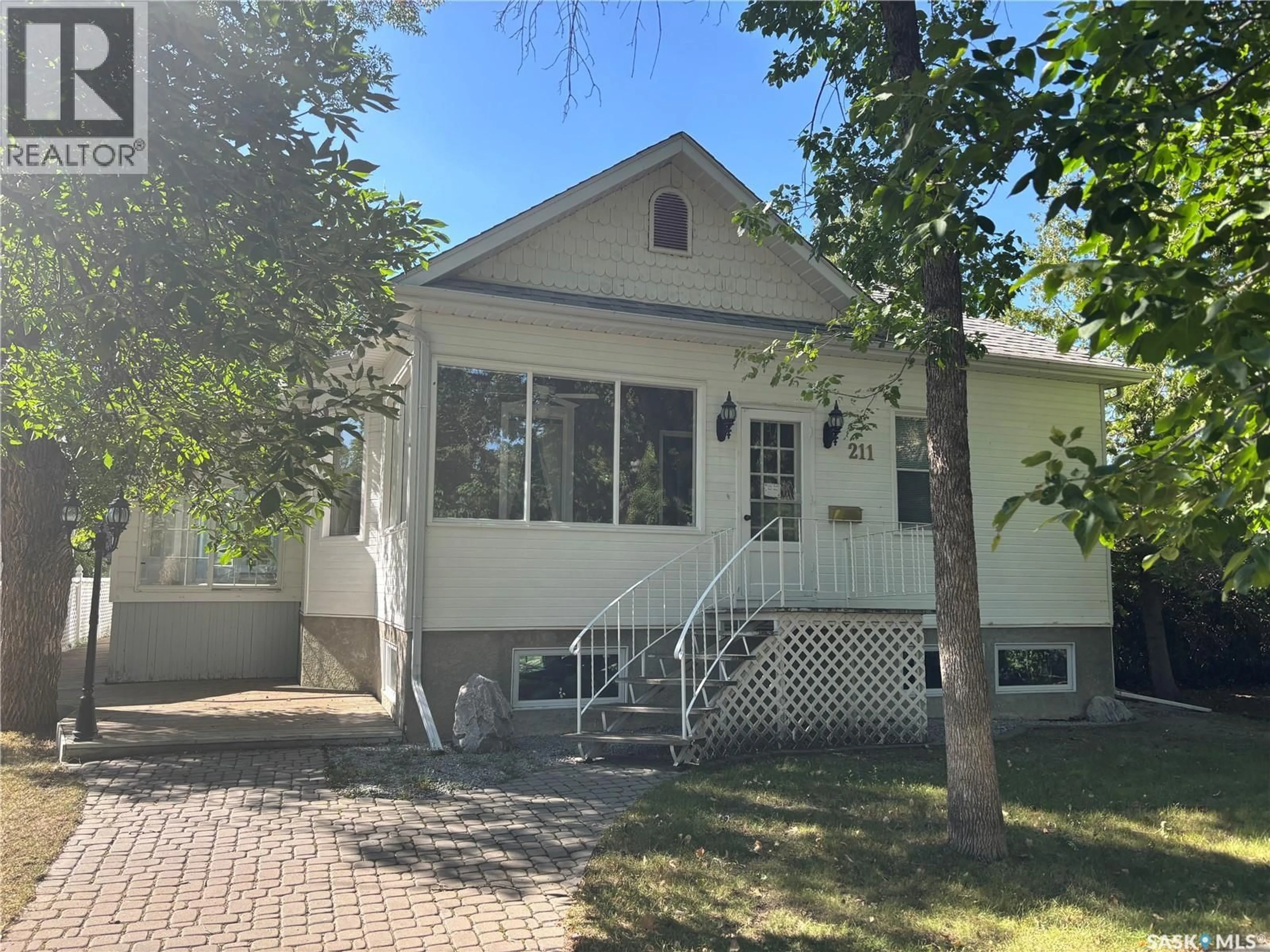 Home with vinyl exterior material, street for 211 ASPEN STREET, Maple Creek Saskatchewan S0N1N0