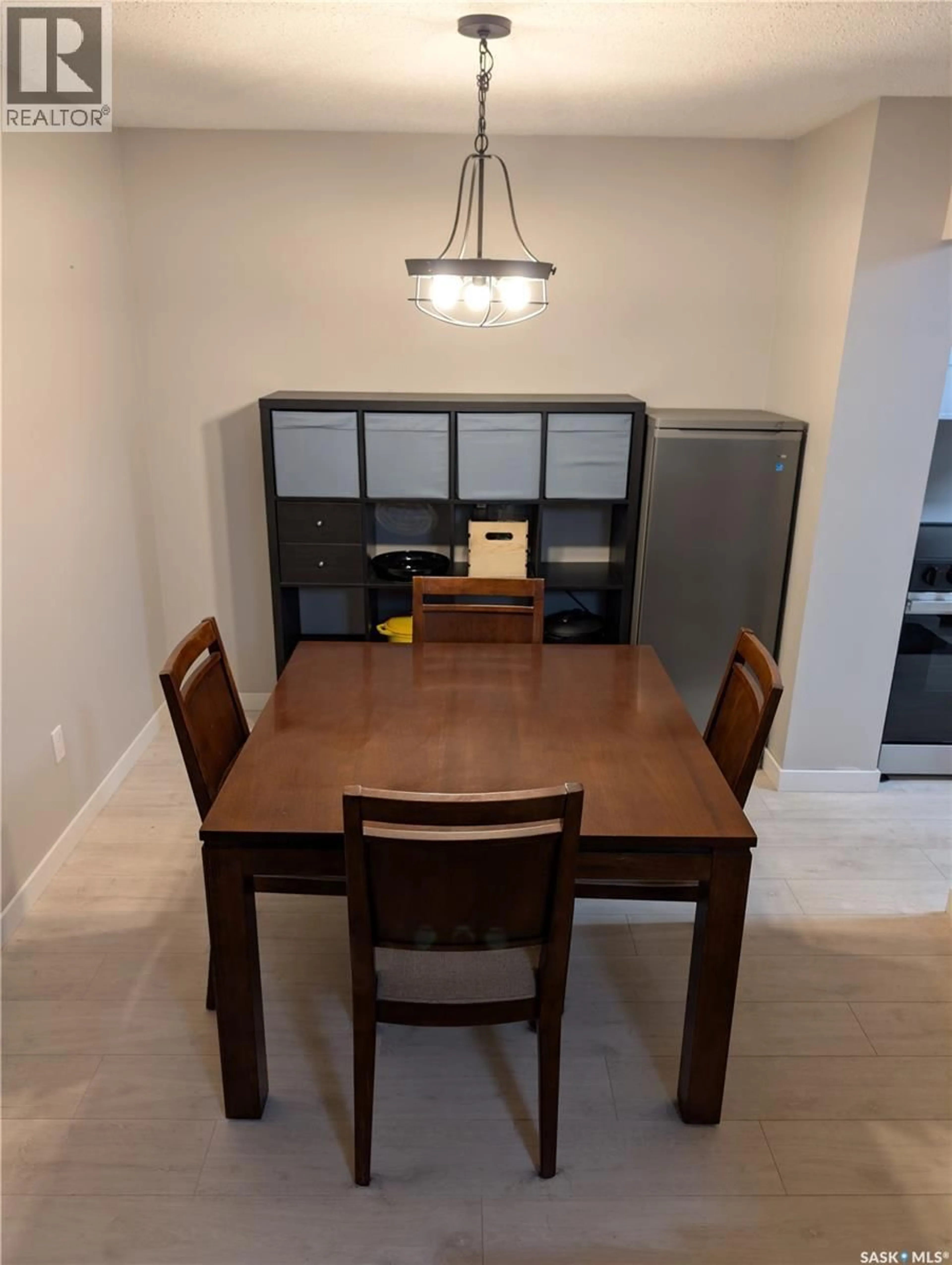 Dining room, wood/laminate floor for 203 - 445 PENDYGRASSE ROAD, Saskatoon Saskatchewan S7M5C1